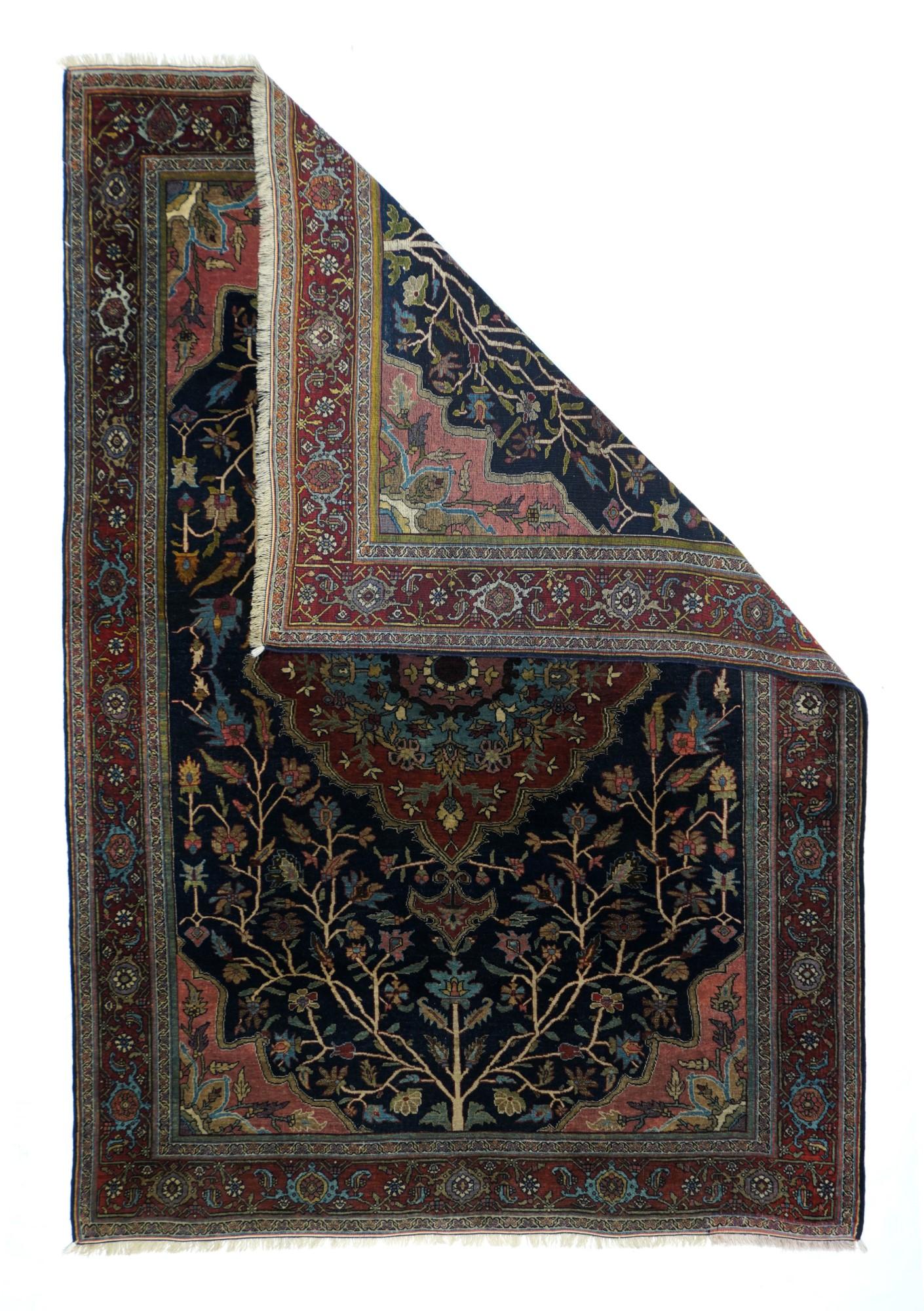 Much in the medallion Heriz style, this west Persian, finely knotted semi-geometric scatter from an accomplished atelier working in the “Halvaie” quality, host a dark blue field centred by a cardinal red scalloped and leaf-edged medallion. Short