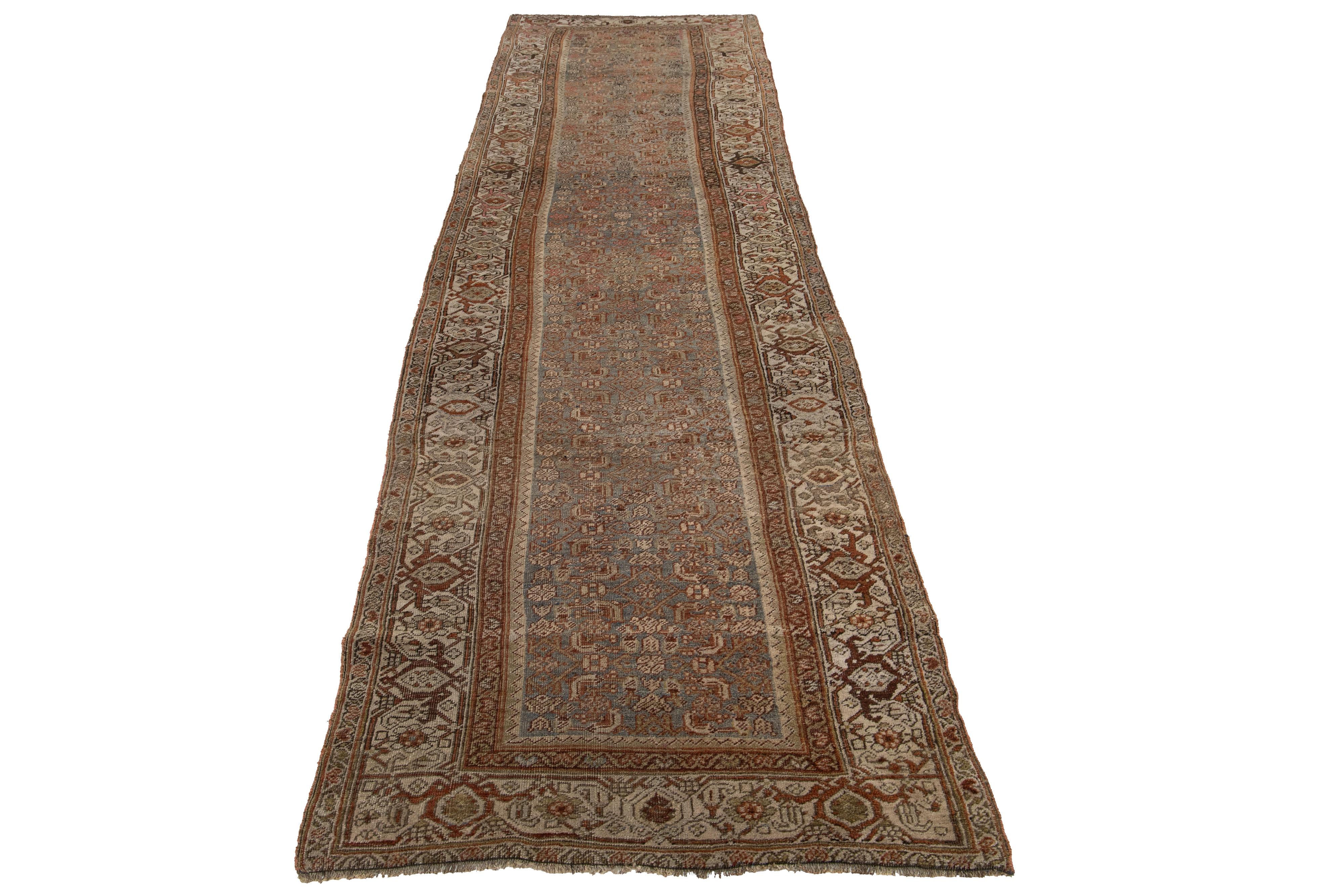 This Persian Bidjar wool rug possesses an antique allure, showcasing impeccable hand-knotted wool in a gray field. The floral pattern is embellished with rust, brown, and pink accents.

This rug measures 3'5