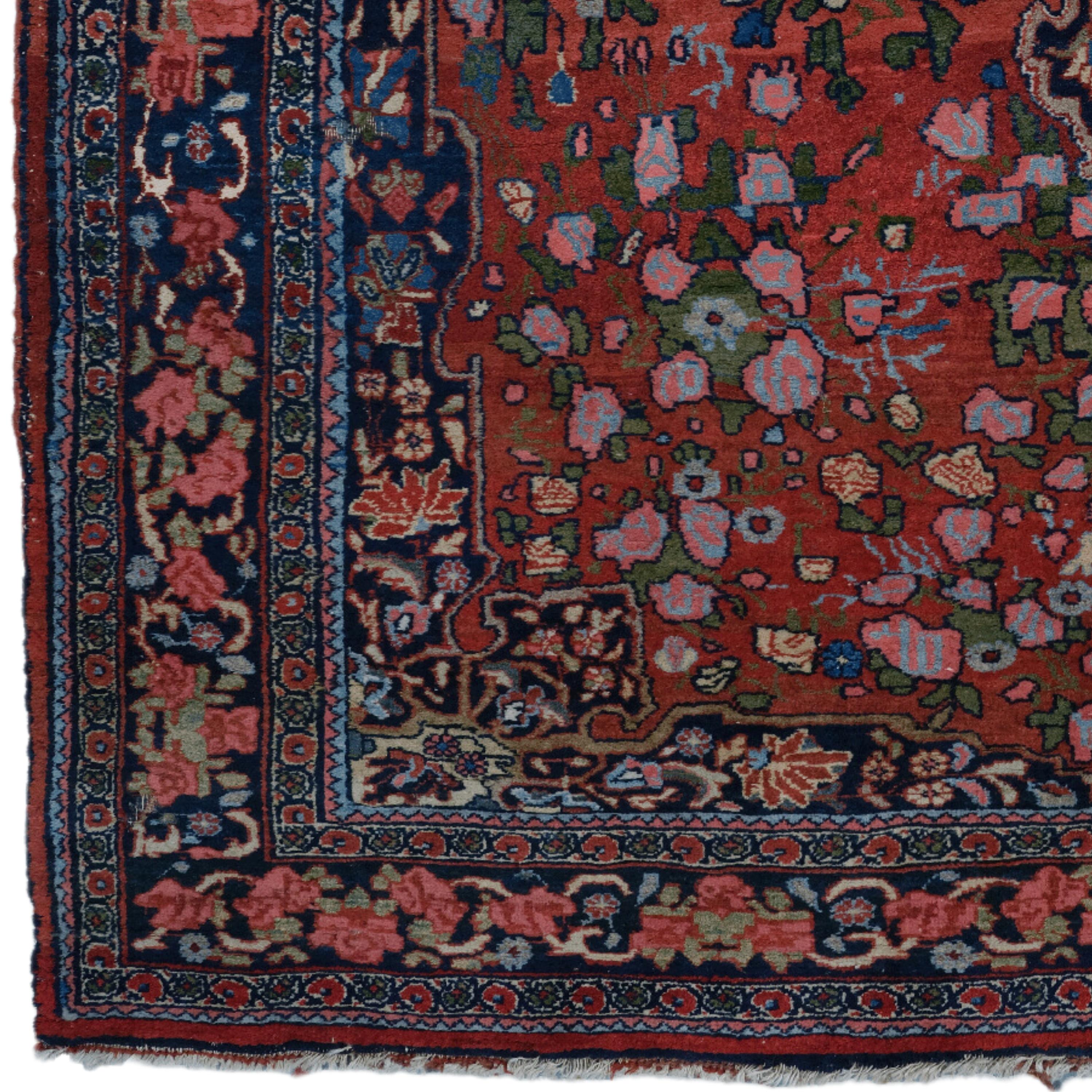 This elegant 19th century Bidjar rug is a work of art, carefully woven and withstood the test of time. The dark red primary color palette is perfectly complemented by detailed patterns in various colors. The complex motif at the center of the