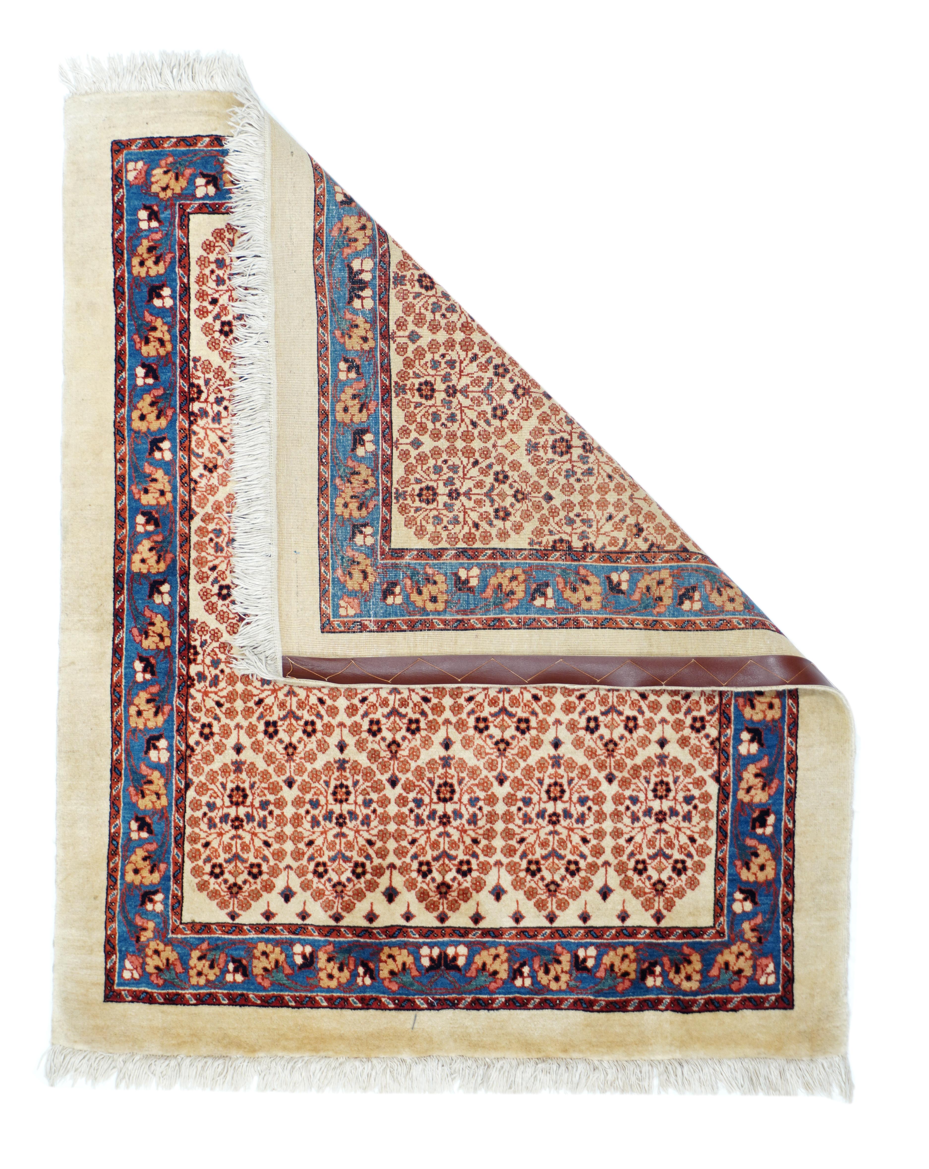 Antique Bidjar rug 3' x 3'4''. On a creamy sand ground are set five offset rows of oval, open floral motives accented in chocolate, dark blue and salmon-rose. Plain milky camel outer surround and medium-blue main border with two types of flowers.