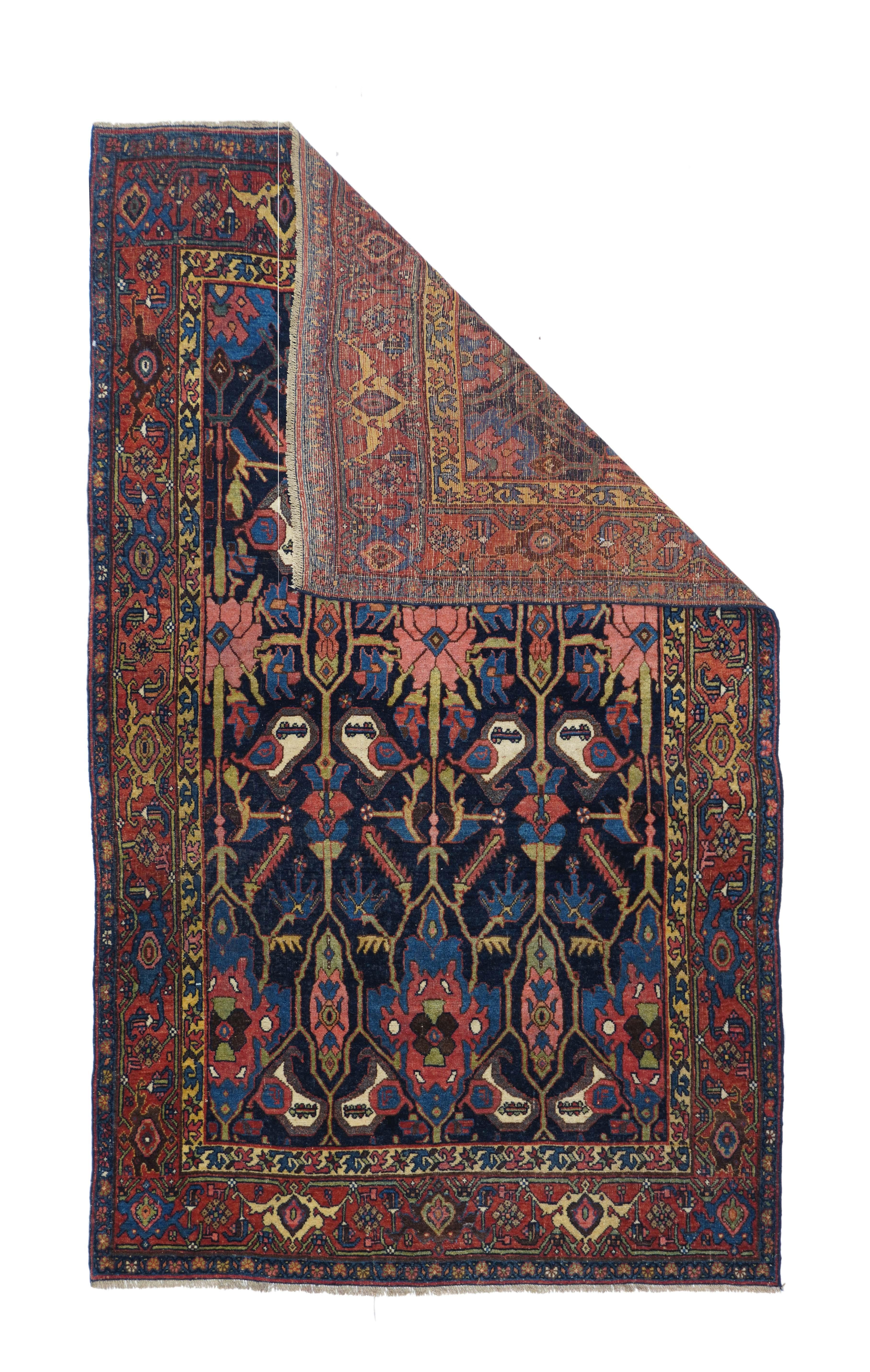 Antique Bidjar Rug 4'1'' x 6'11''. This extremely solid and robust, well-woven Kurdish city scatter presents a navy field with a cartouche lattice enclosing botehs, palmettes, ragged rosettes and tall polygons. Reversing turtle palmettes decorate