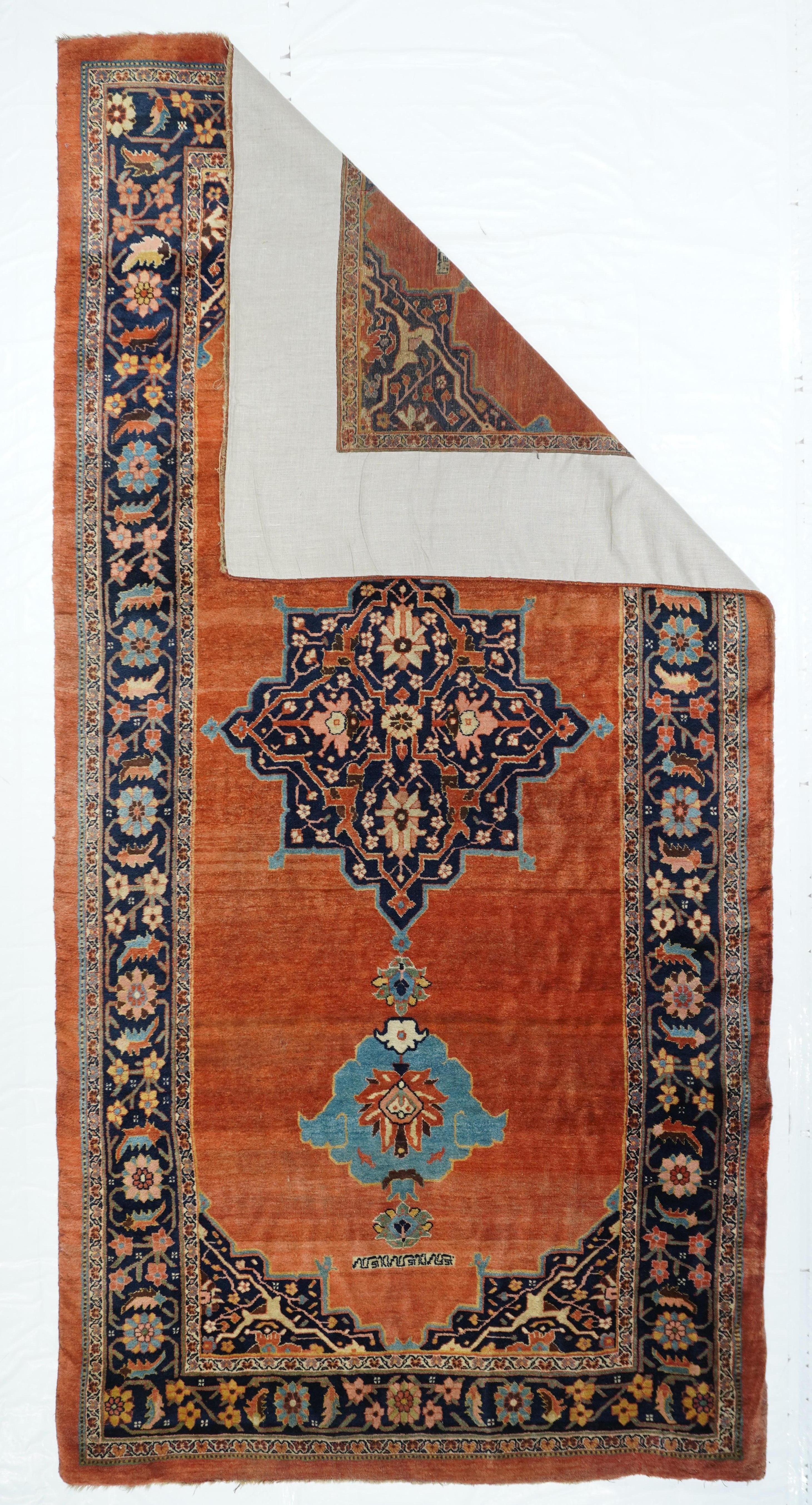 This totally iconic 19th century Kurdish wide kellegi (long rug) shows a =n open abrashed red field supporting a navy octogramme medallion enclosing four petal palmettes and a red forked arabesquerie. Light blue layered palmette pendants. Navy