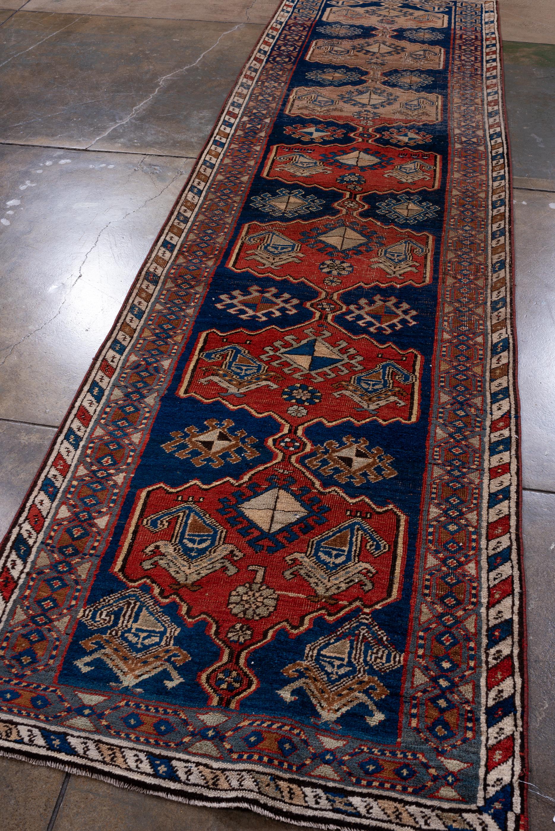Persian Antique Bidjar Runner with Royal Blue Field with Ivory and Red Designs For Sale