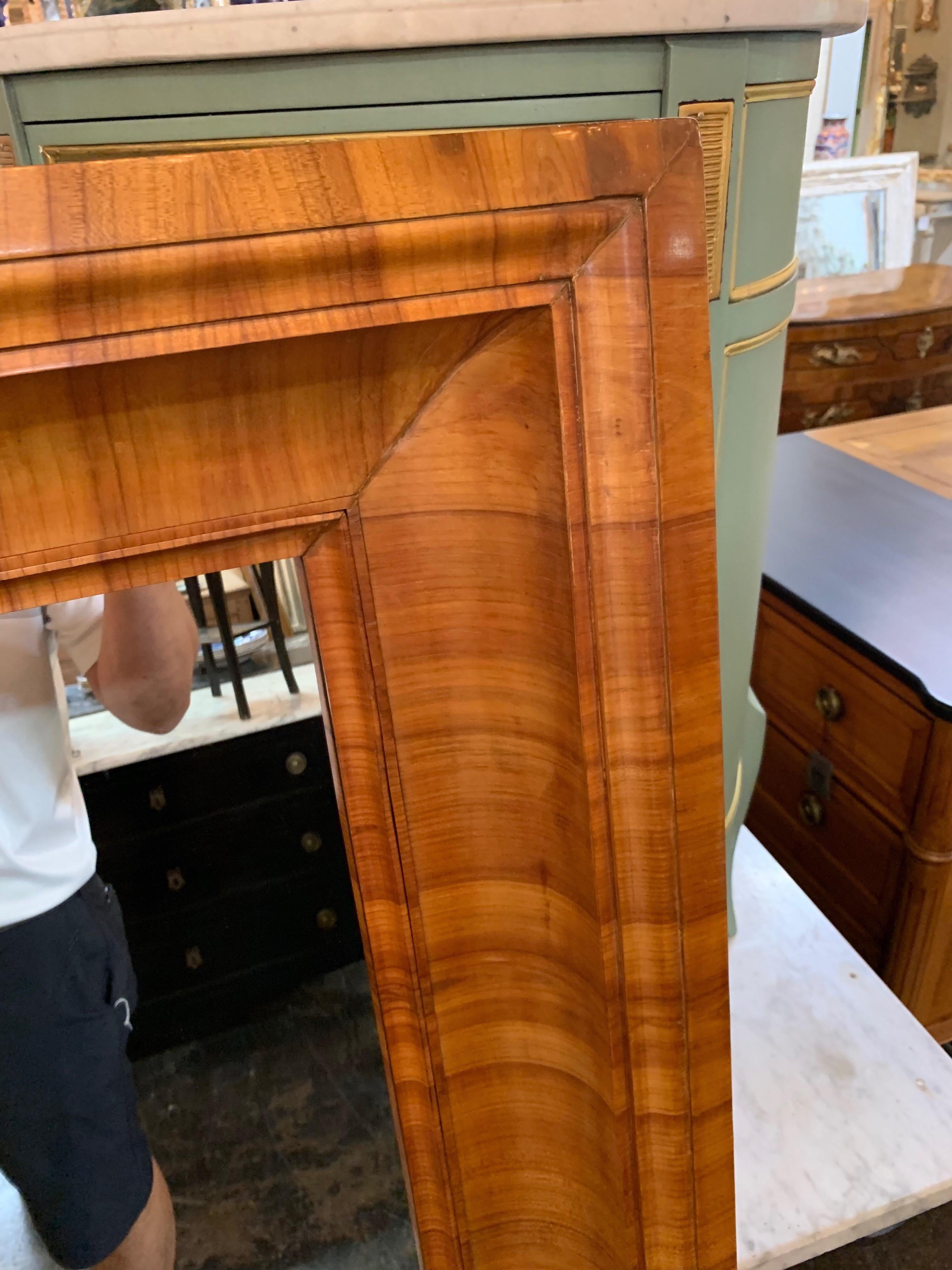Very handsome antique Biedermeier mirror made of solid cherry wood. Beautiful wood grain on this substantial piece that would be a focal point in any room.