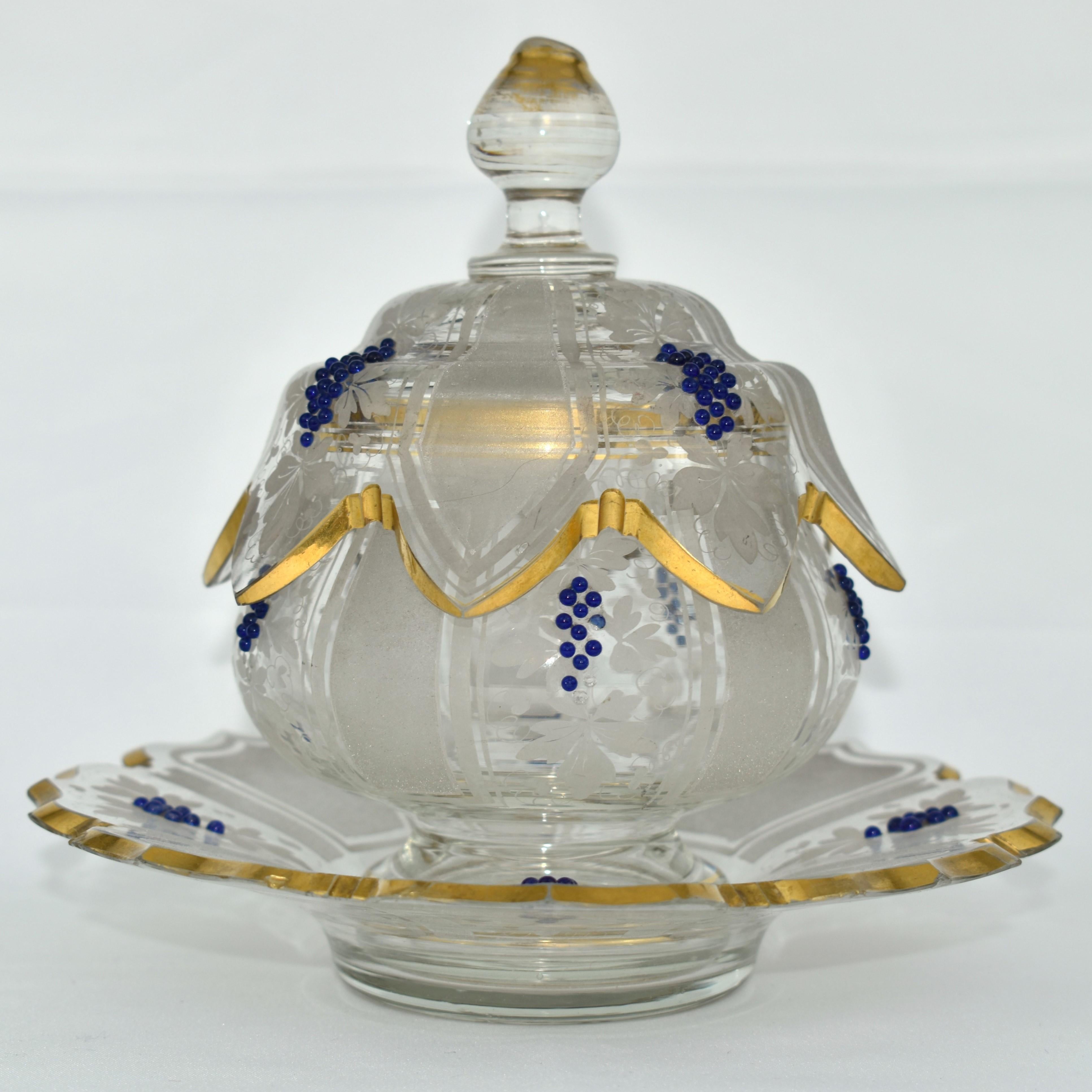 Exceptional bowl with saucer

Fine quality of the 19th Century glass manufacture

Hand painted with rich and impressive white enamel decoration and gilding highlights

Cobalt blue beads in form of grapes

Plate and cover with cut and gilded