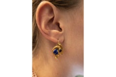 Antique Biedermeier gold earrings with garnets and enamel, circa 1850.