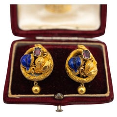 Antique Biedermeier gold earrings with garnets and enamel, circa 1850.