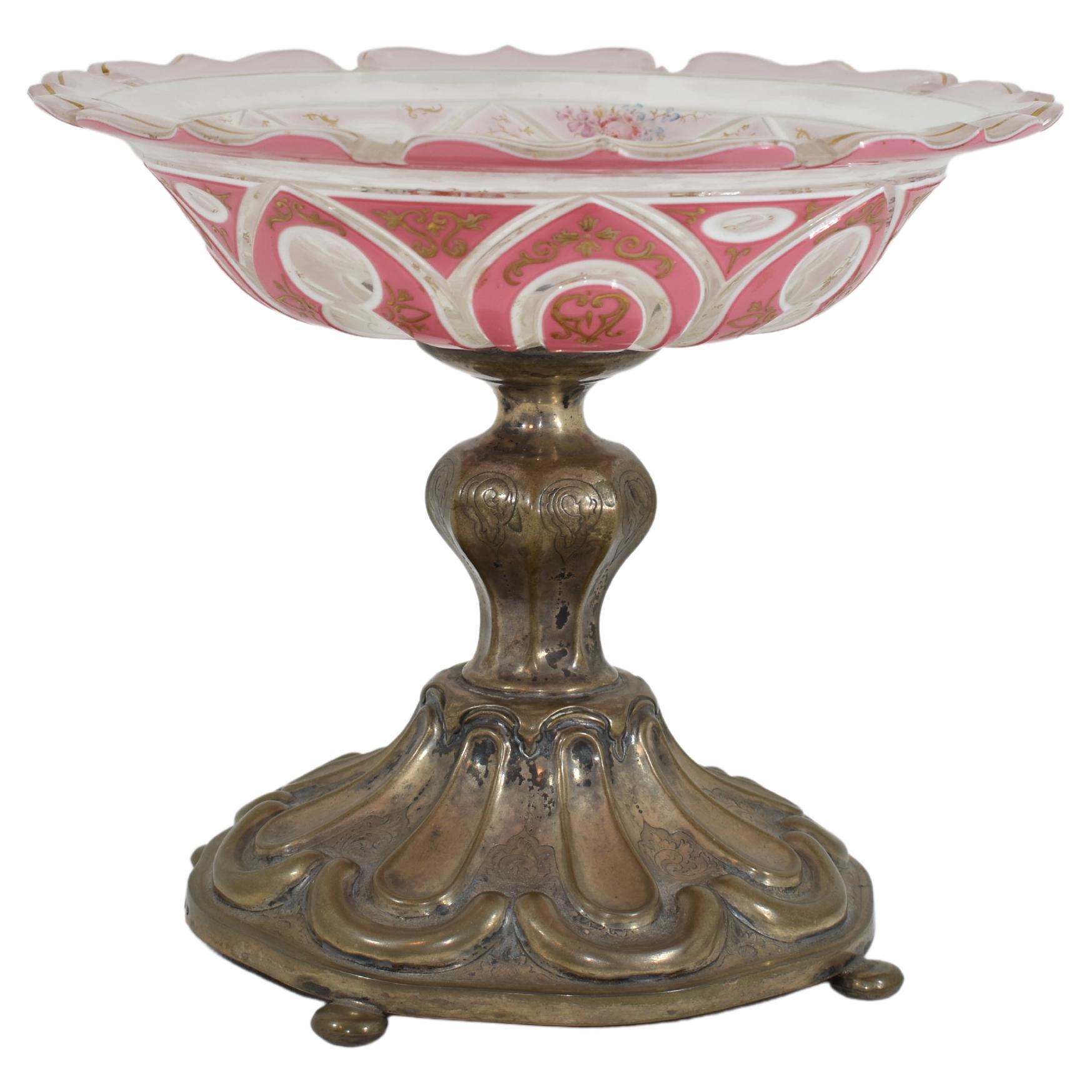 Antique tazza bowl with metal stand.
Double overlay, transparent glass overlaid with two layers of opaline glass
the pink layer is decorated with gilded enamel scrollworks
further enamel decoration on the inside of the bowl.
19th Century.