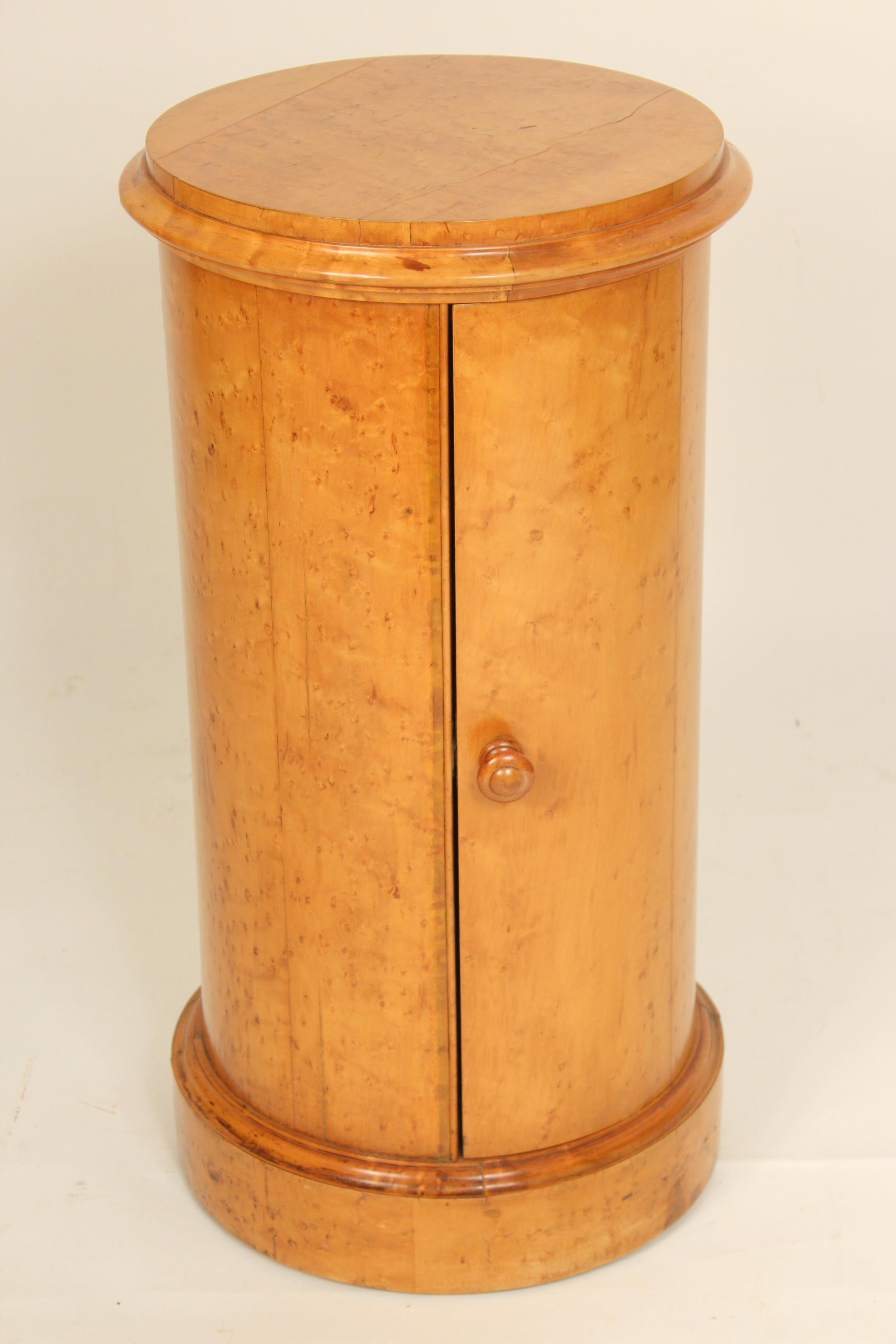 Antique Biedermeier style burl ash single door cylinder commode / pedestal, circa 1900. The overall diameter is 16