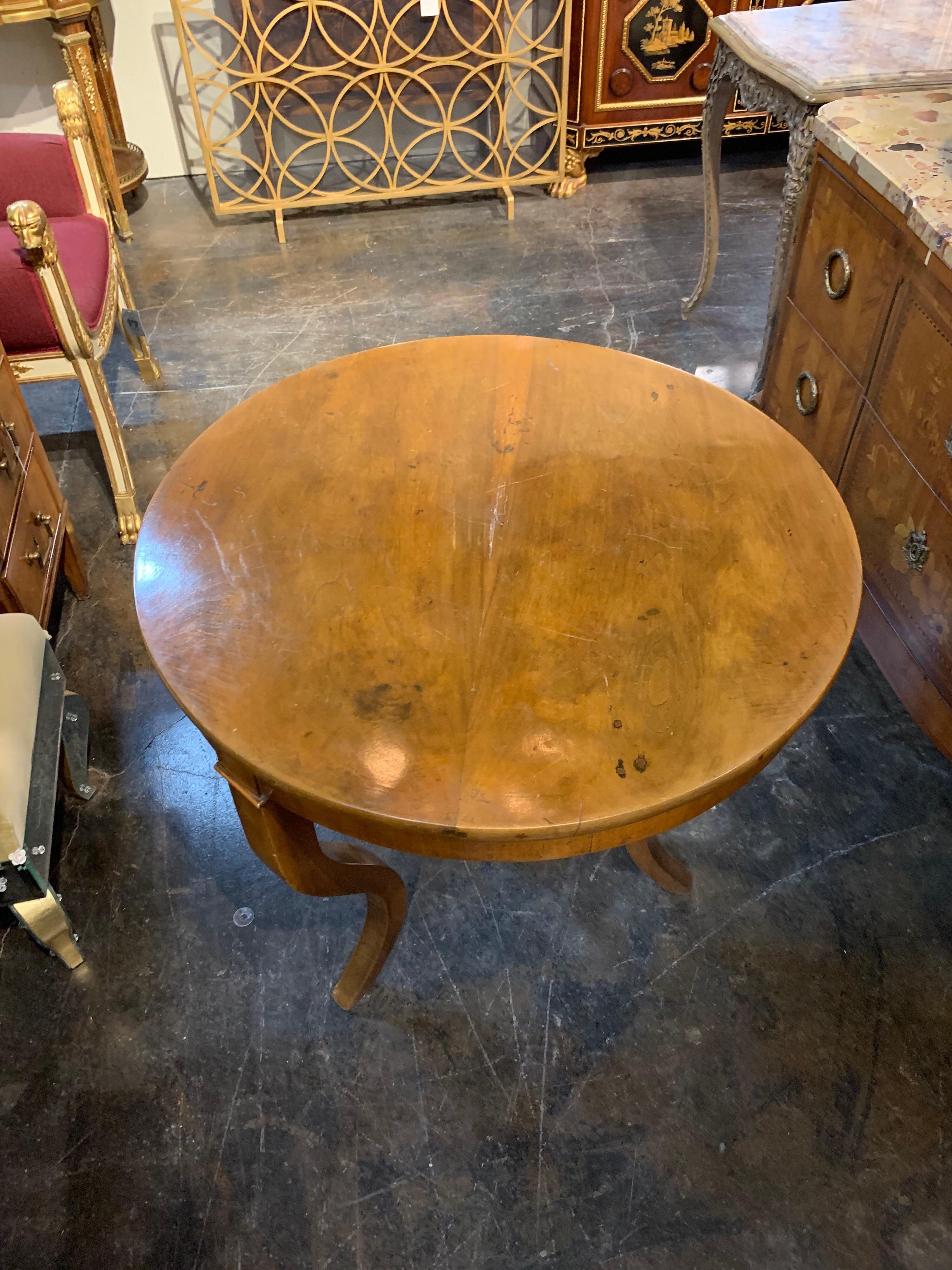 Handsome antique Biedermeier side table. Nice polished finish and a classic style!
 