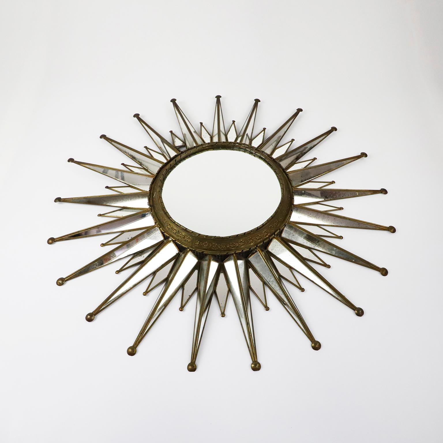 Circa 1950, we offer this big size mexican artisanal sunburst mirror. Made in steel, bass details and fantastic patina.