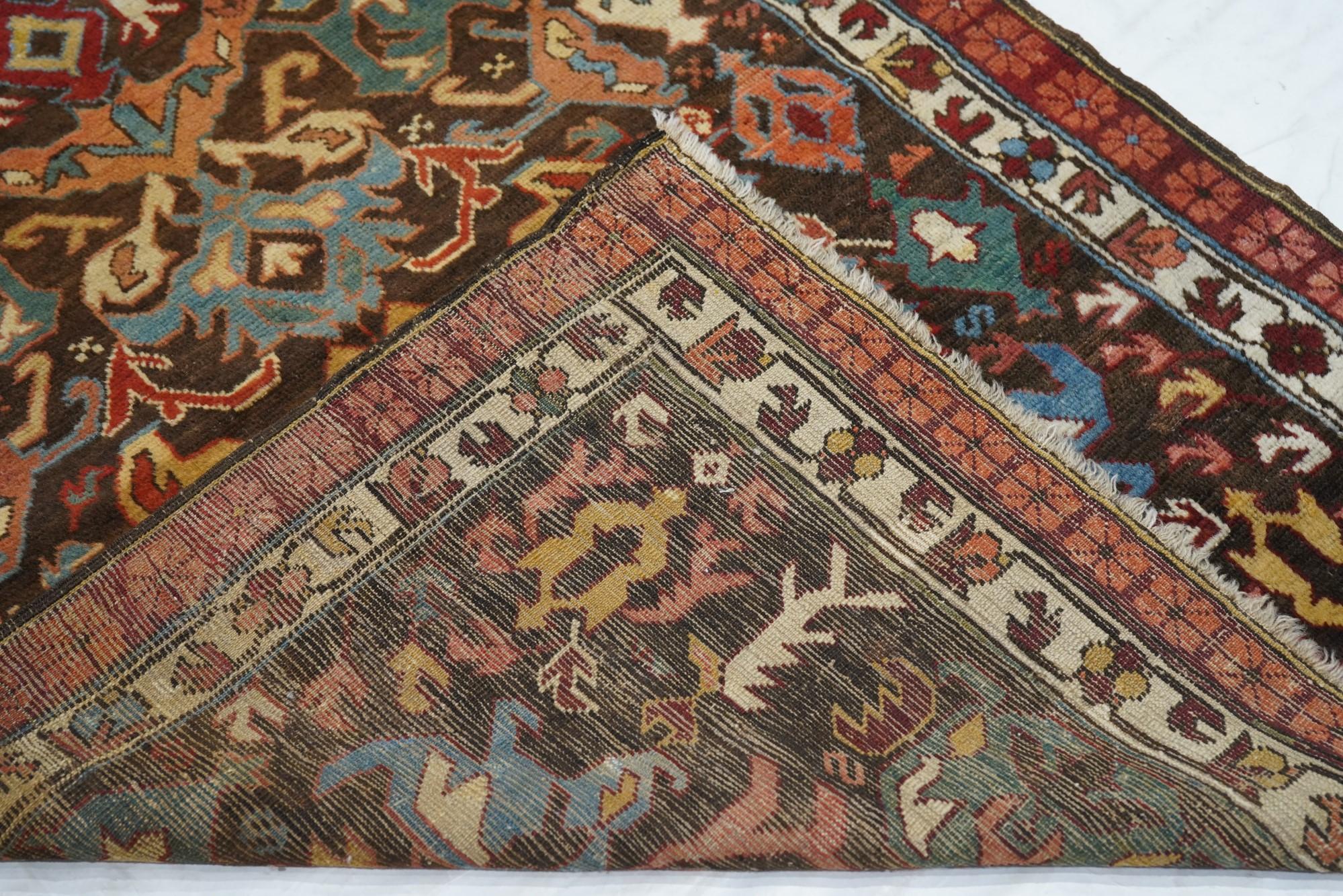 Antique Bijov Rug 3'5'' x 5'. West Caspian/East Caucasian rustic scatter with a characteristic abstract ascending leaf, palmette and flower design. Usually found on long rugs, but less so on small scatters. Dark blue ground, yellow, rust, teal light