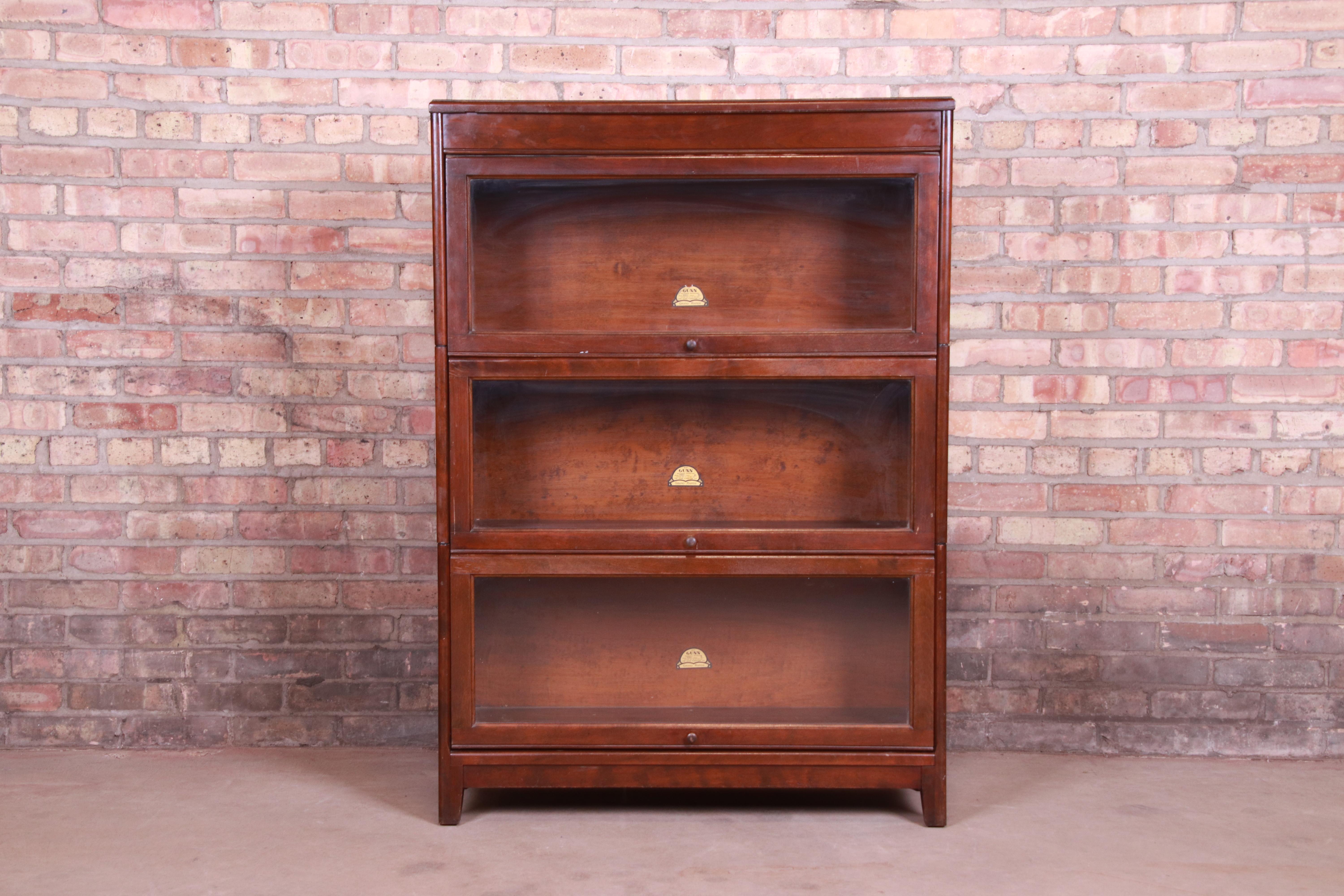 A gorgeous antique three-stack barrister bookcase.

By Gunn Furniture Co.,

USA, circa 1930s

Birch, with glass front doors.

Measures: 34.5