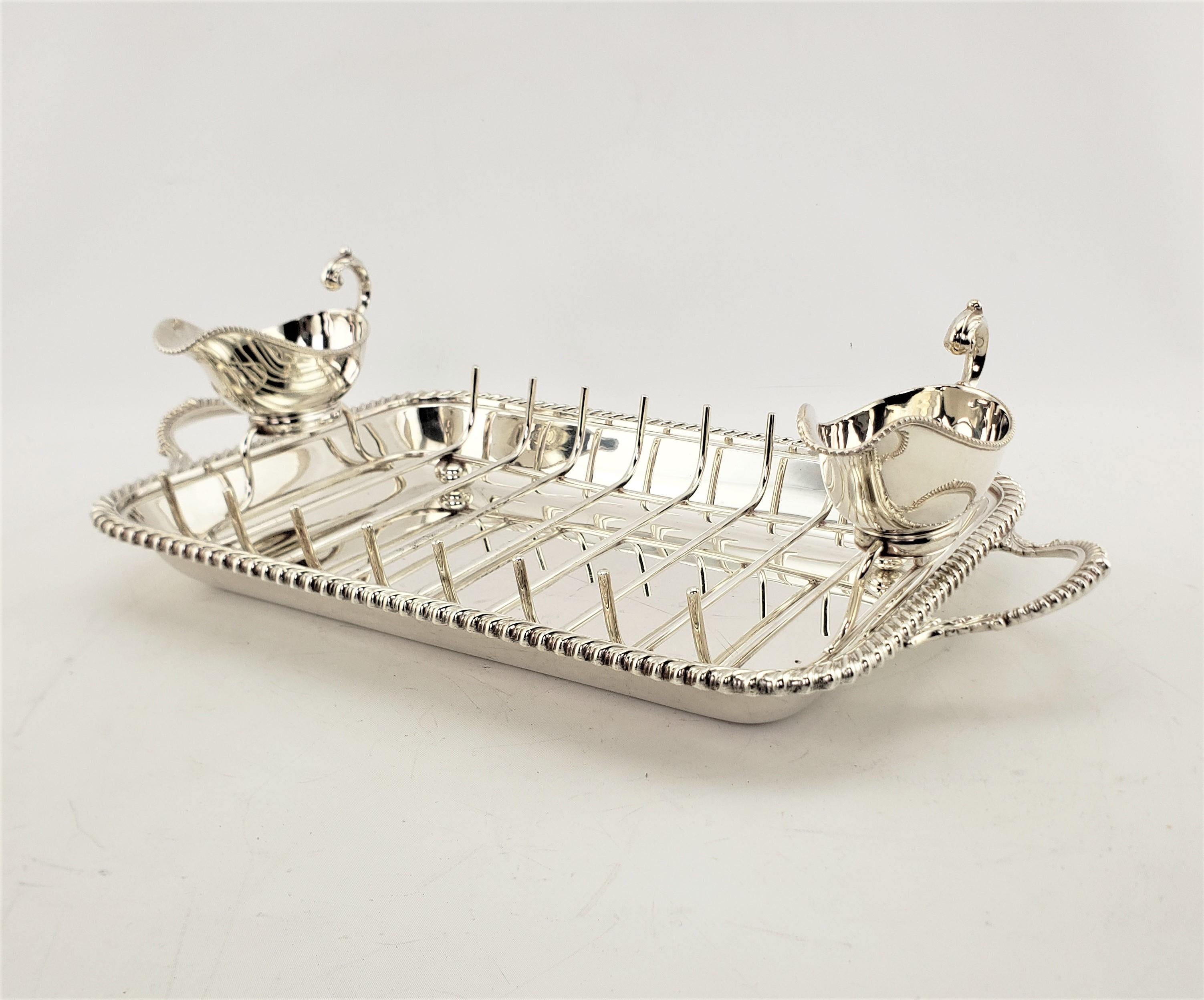 This antique well made silver plated asparagus service or meat server originated from England and made for the renowned Canadian Birks department store chain and dates to approximately 1900 and done in a Victorian style. The set is composed of a