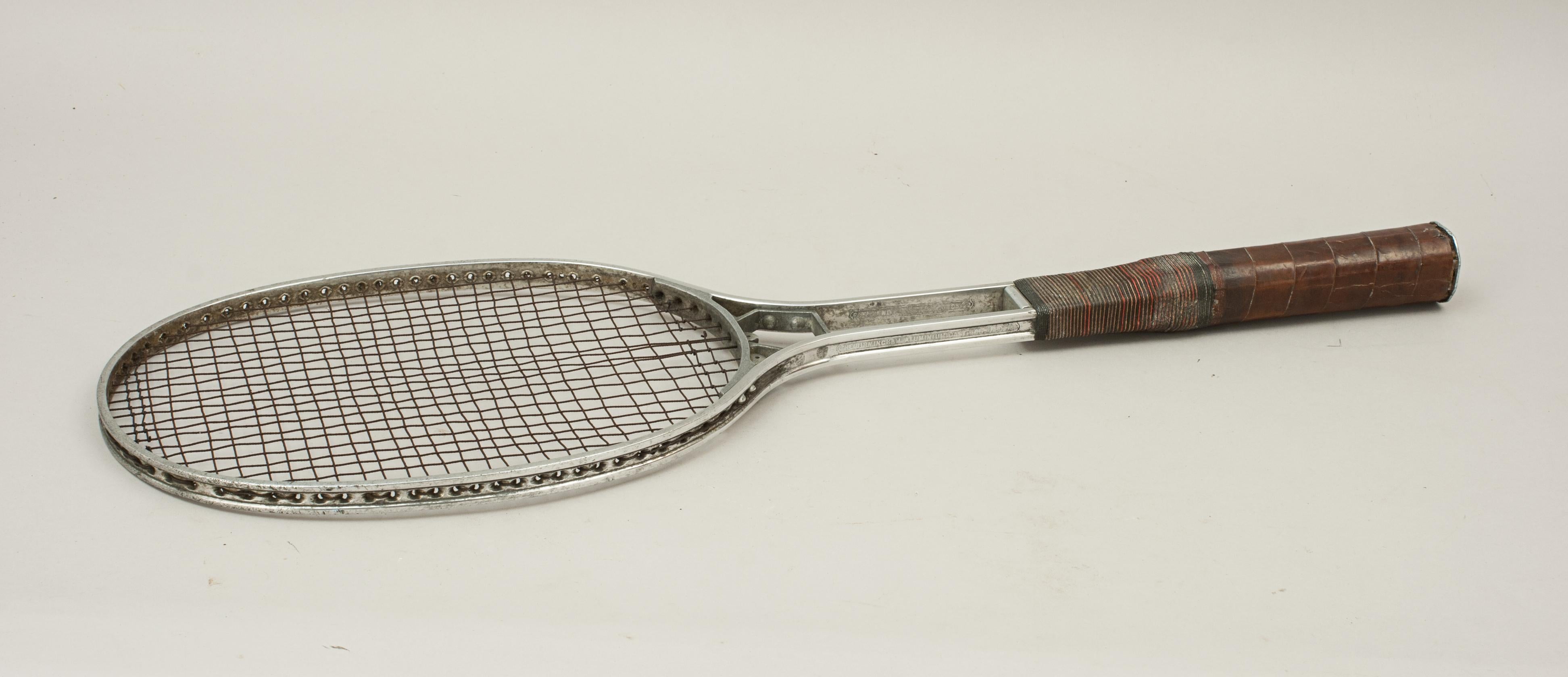 Vintage tennis racket, Birmal all metal racket.
A fine 'Birmal' all metal lawn tennis racket made by the Birmingham Aluminium casting Co. The racket has the original metal strings, the aluminium frame has the Regd No.693327 on the throat and the