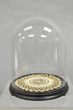 Antique Bisque Porcelain Seated Baby Figurine in Circular Glass Display Cloche