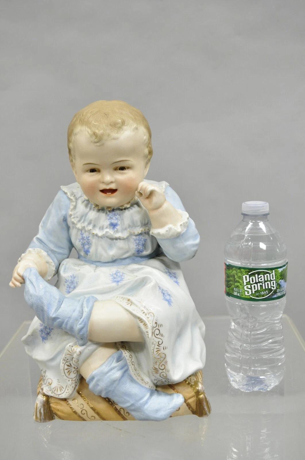 Victorian Antique Bisque Porcelain Seated Baby Figurine in Circular Glass Display Cloche For Sale