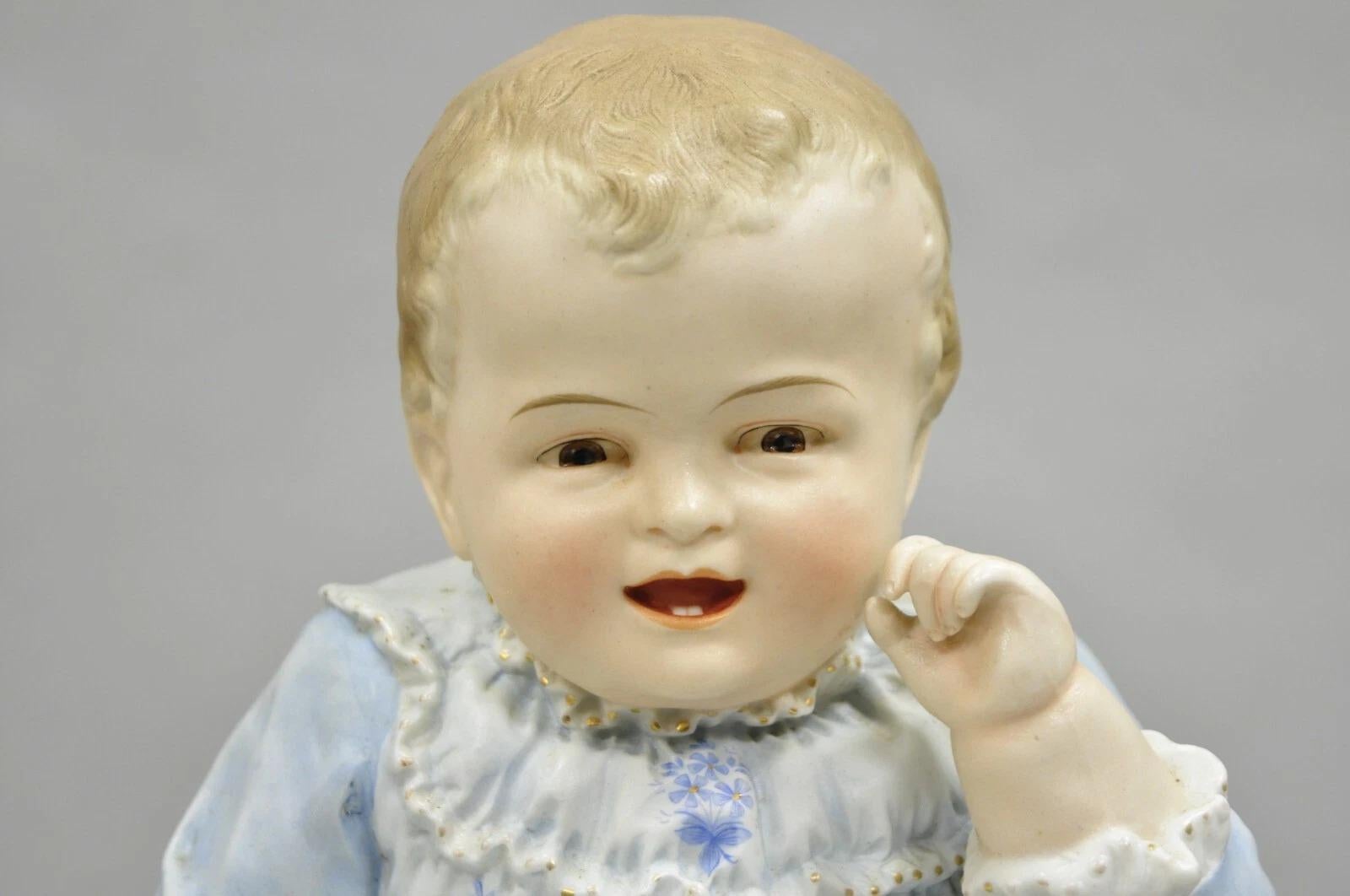 Unknown Antique Bisque Porcelain Seated Baby Figurine in Circular Glass Display Cloche For Sale