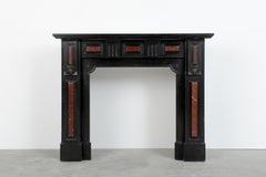 Cheminée ancienne en marbre noir et rouge