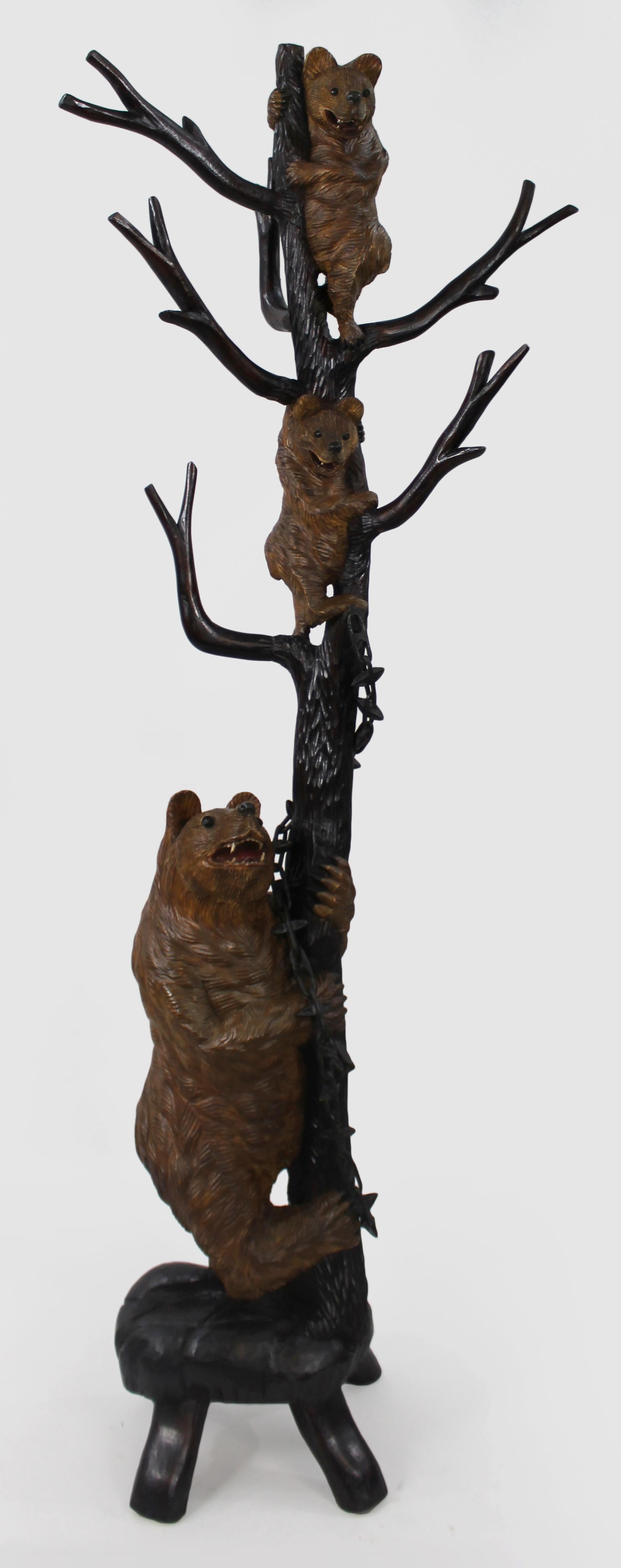 Antique Black Forest Carved Bear Coat Stand
This finely crafted Black Forest coat stand dates from the late 19th to early 20th century. The piece is beautifully carved in the form of a tree, with a mother bear at the base and two cubs climbing