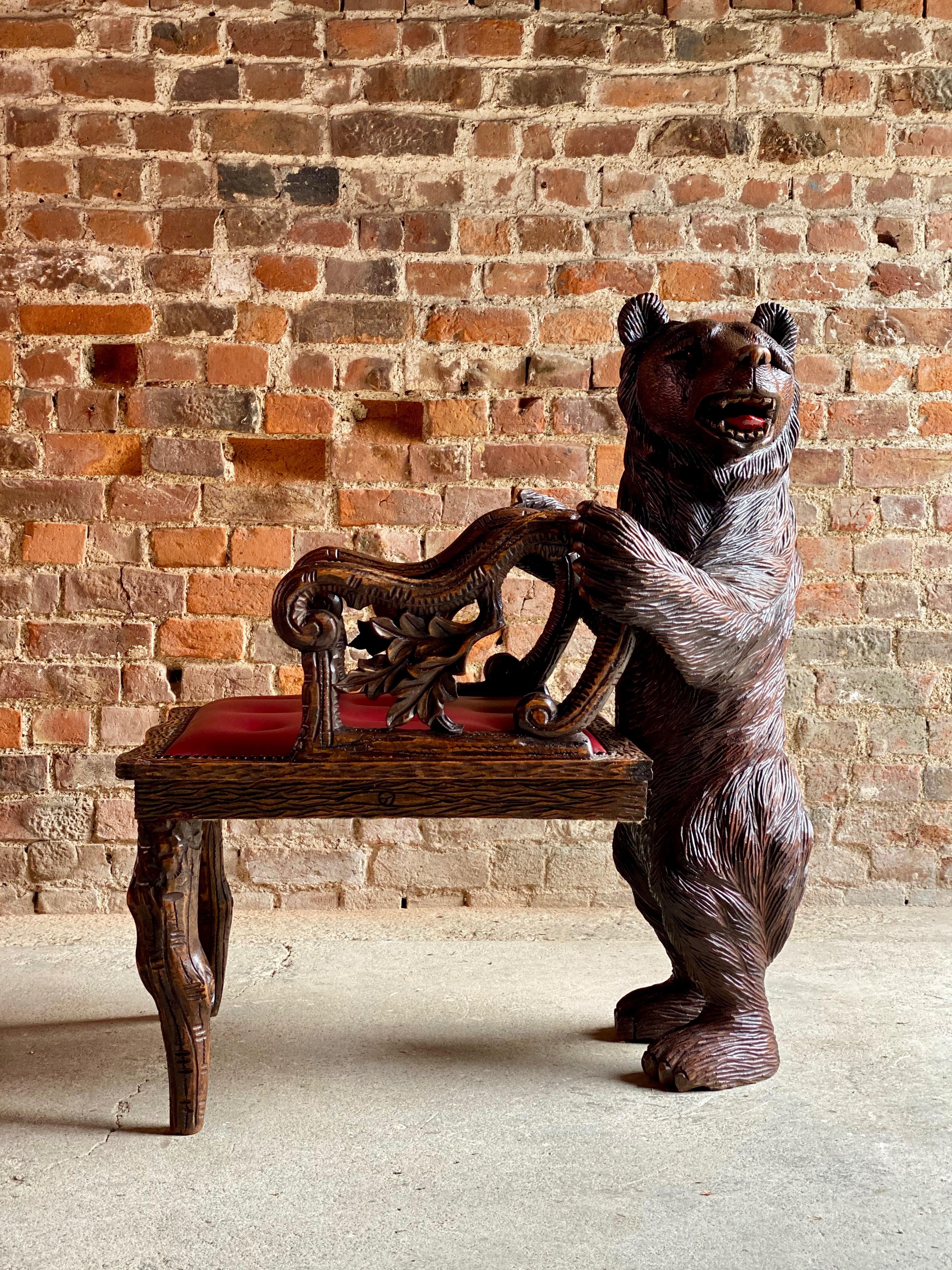 Antique Black Forest carved bear hall chair armchair, 19th century, circa 1875

Magnificent Swiss 19th century Black Forest carved bear hall chair circa 1875, the bear standing on his hind legs looking to his left with his mouth open showing teeth