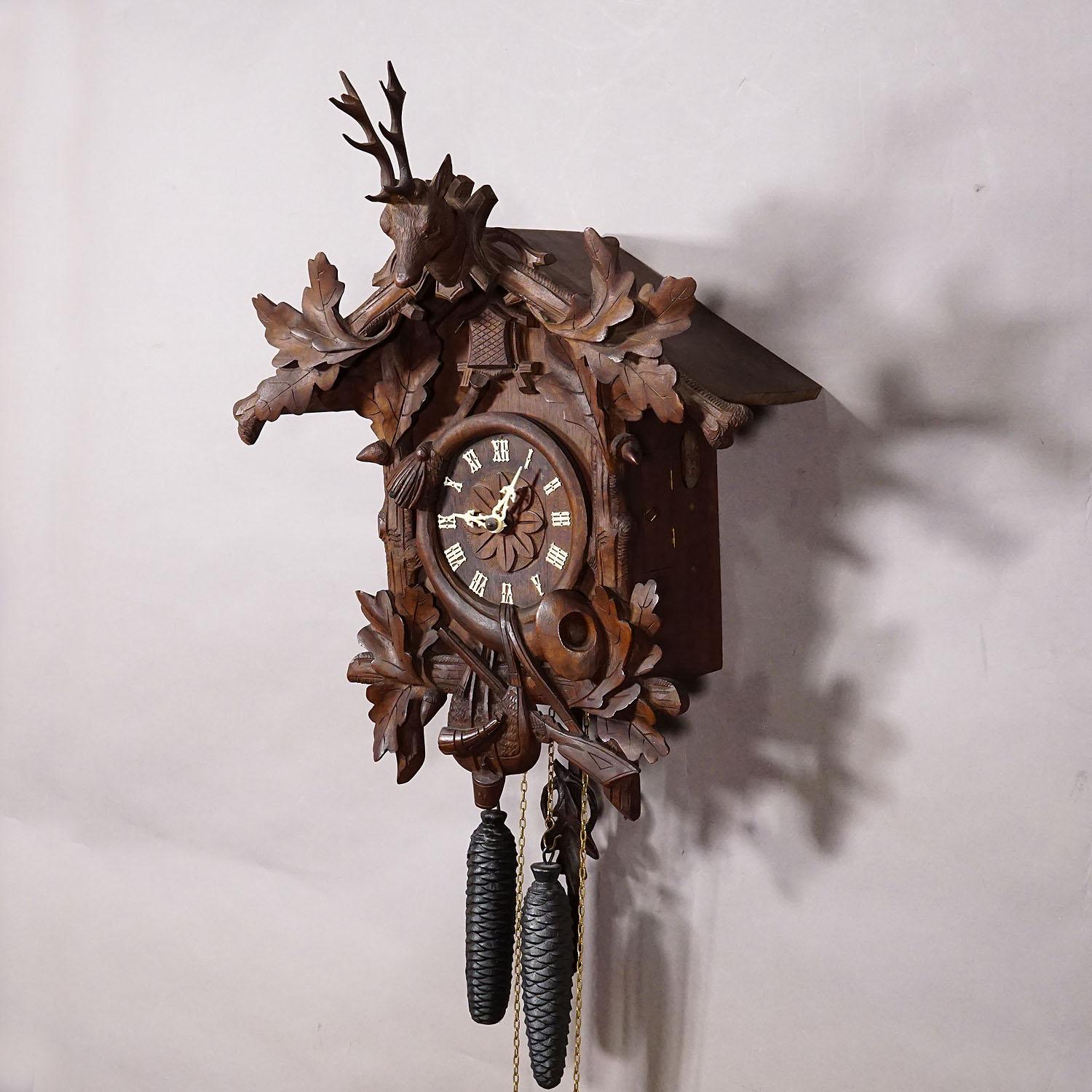 German Antique Black Forest Carved Cuckoo Clock with Stag Head on Top For Sale