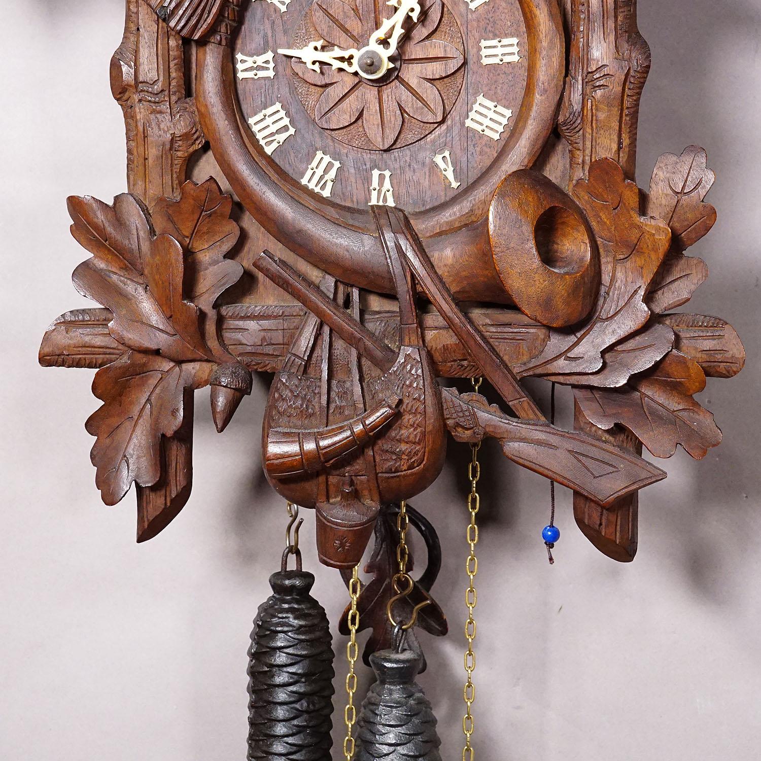 Wood Antique Black Forest Carved Cuckoo Clock with Stag Head on Top For Sale