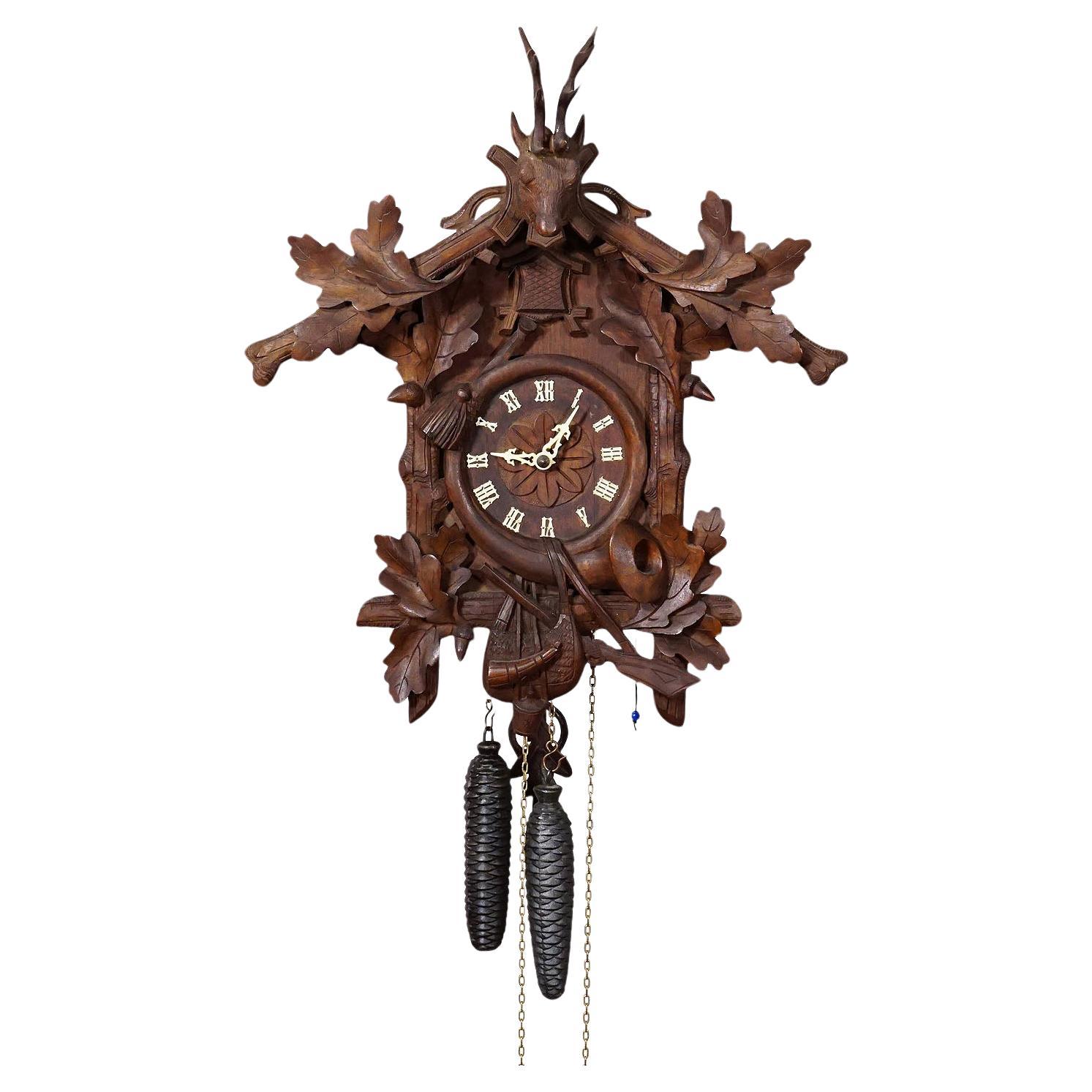Antique Black Forest Carved Cuckoo Clock with Stag Head on Top For Sale