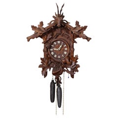 Antique Black Forest Carved Cuckoo Clock with Stag Head on Top