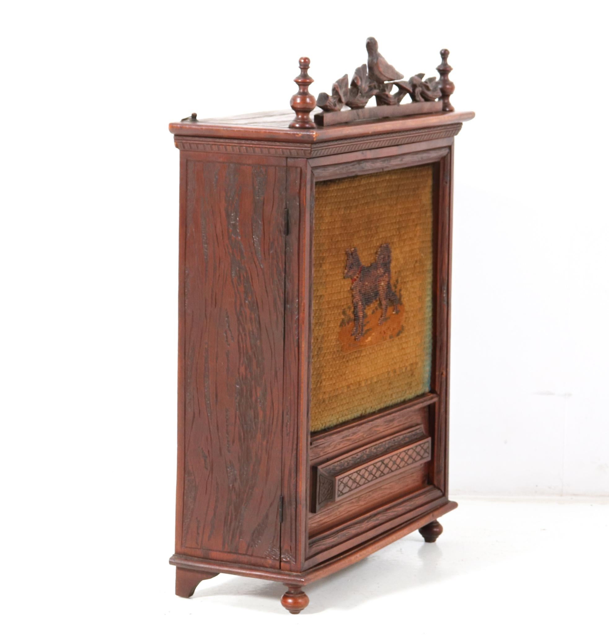 Early 20th Century Antique Black Forest Carved Oak Wall Cabinet, 1900s For Sale