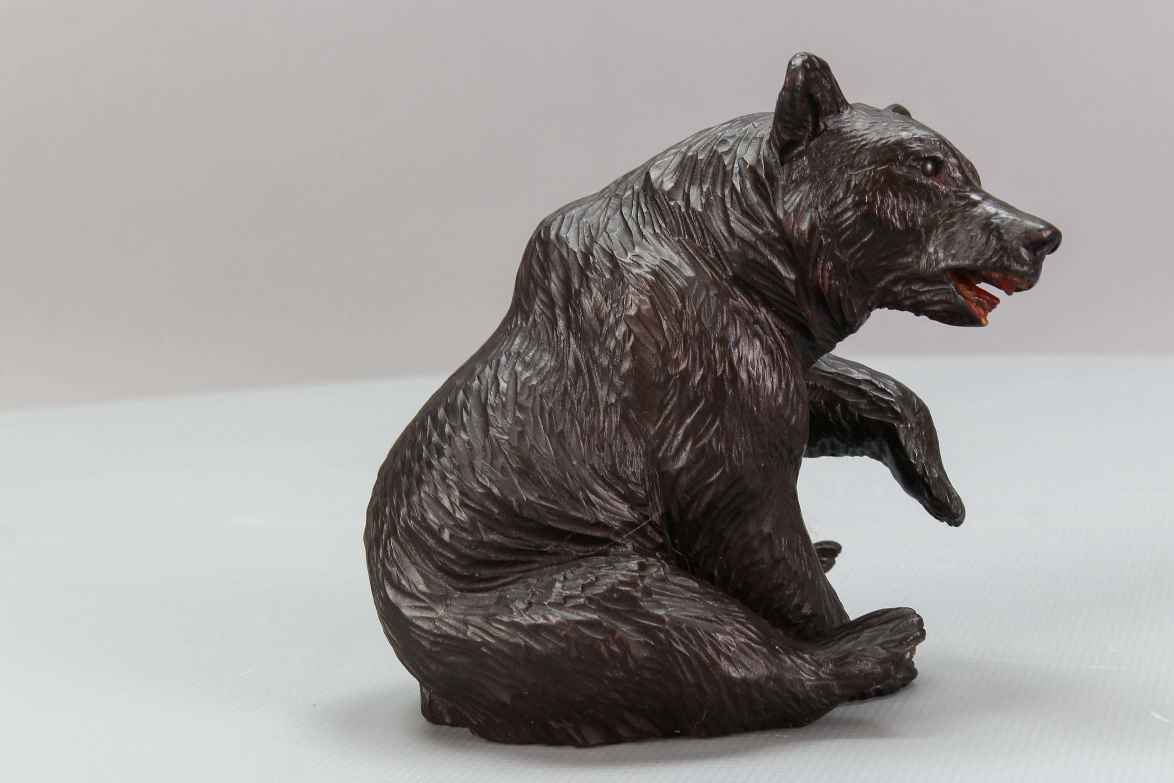 Hand-Carved Antique Black Forest Carved Seated Bear Figure For Sale