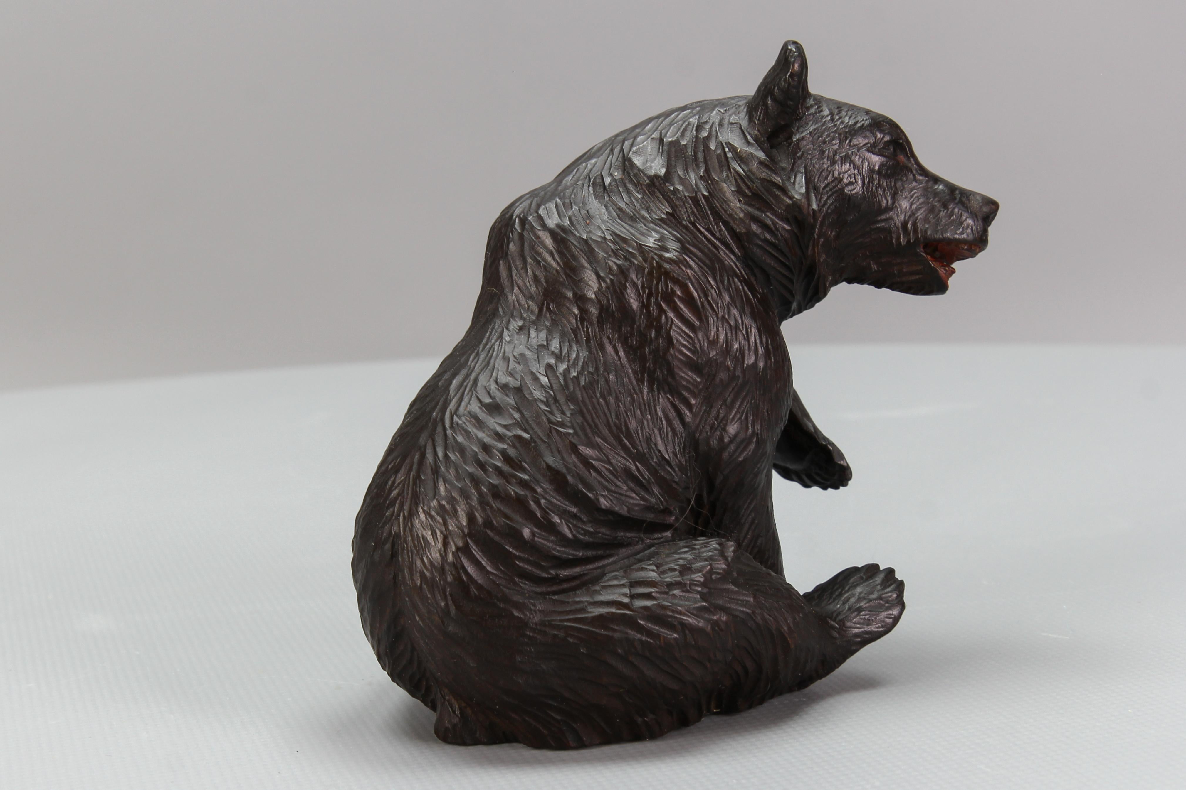 Hand-Carved Antique Black Forest Carved Seated Bear Figure For Sale