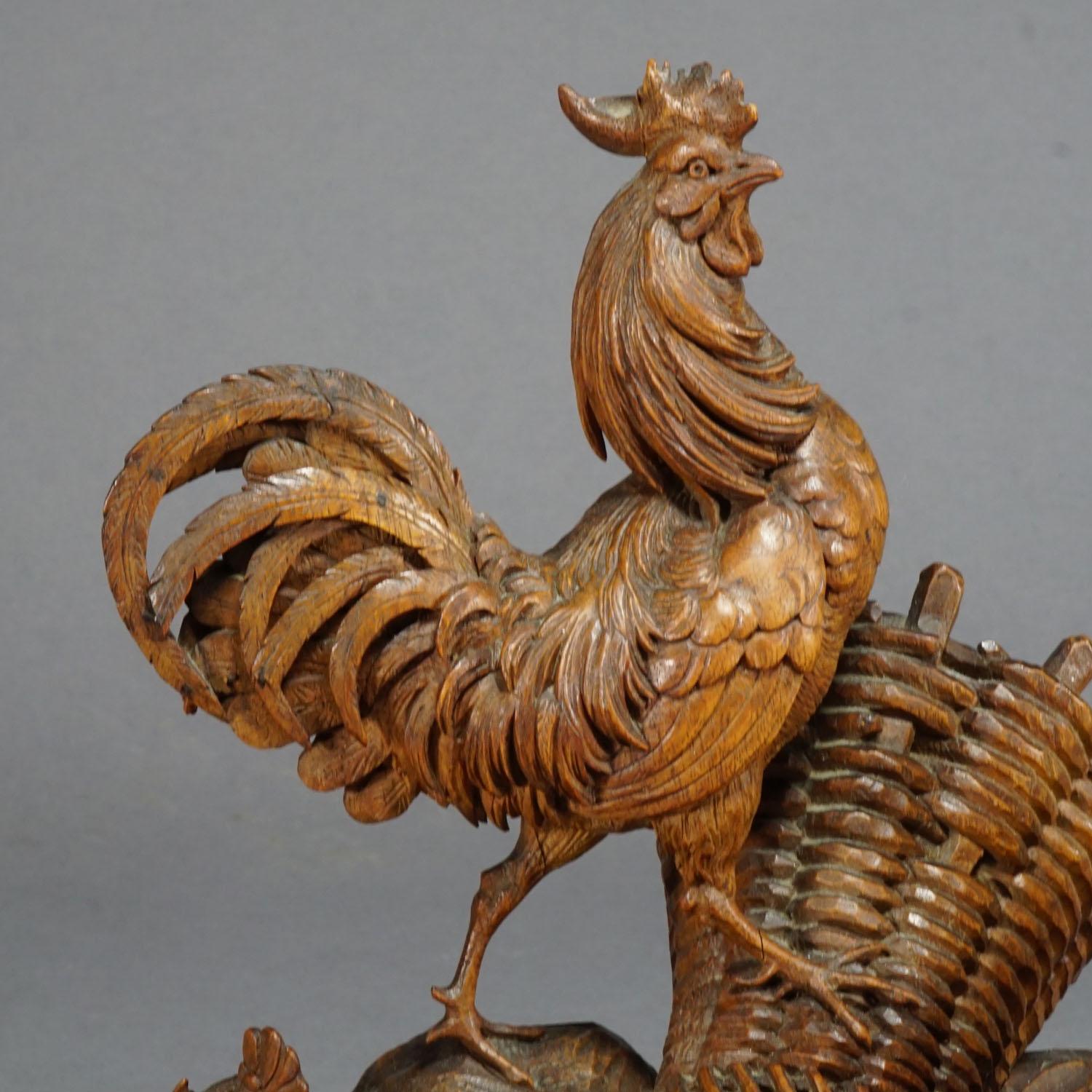 A nice hand carved wooden statue of a chicken family with cock, hen and some chicks. A very detailed woodcarving manufactured most probably in France circa 1900

Measures: Width 11.02