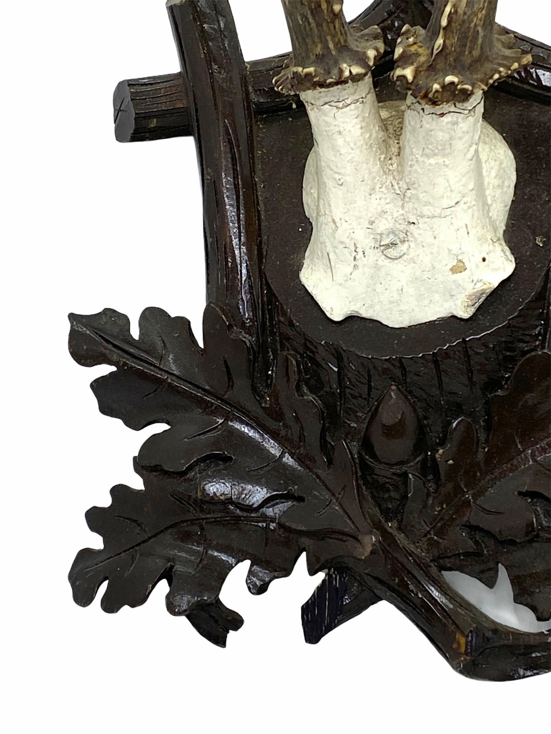 A beautiful antique Black Forest deer antler trophy on hand carved, Black Forest wooden plaque. A nice addition to your hunter’s loge, cabin or just to display it in your house. Found at an estate sale in Vienna, Austria.