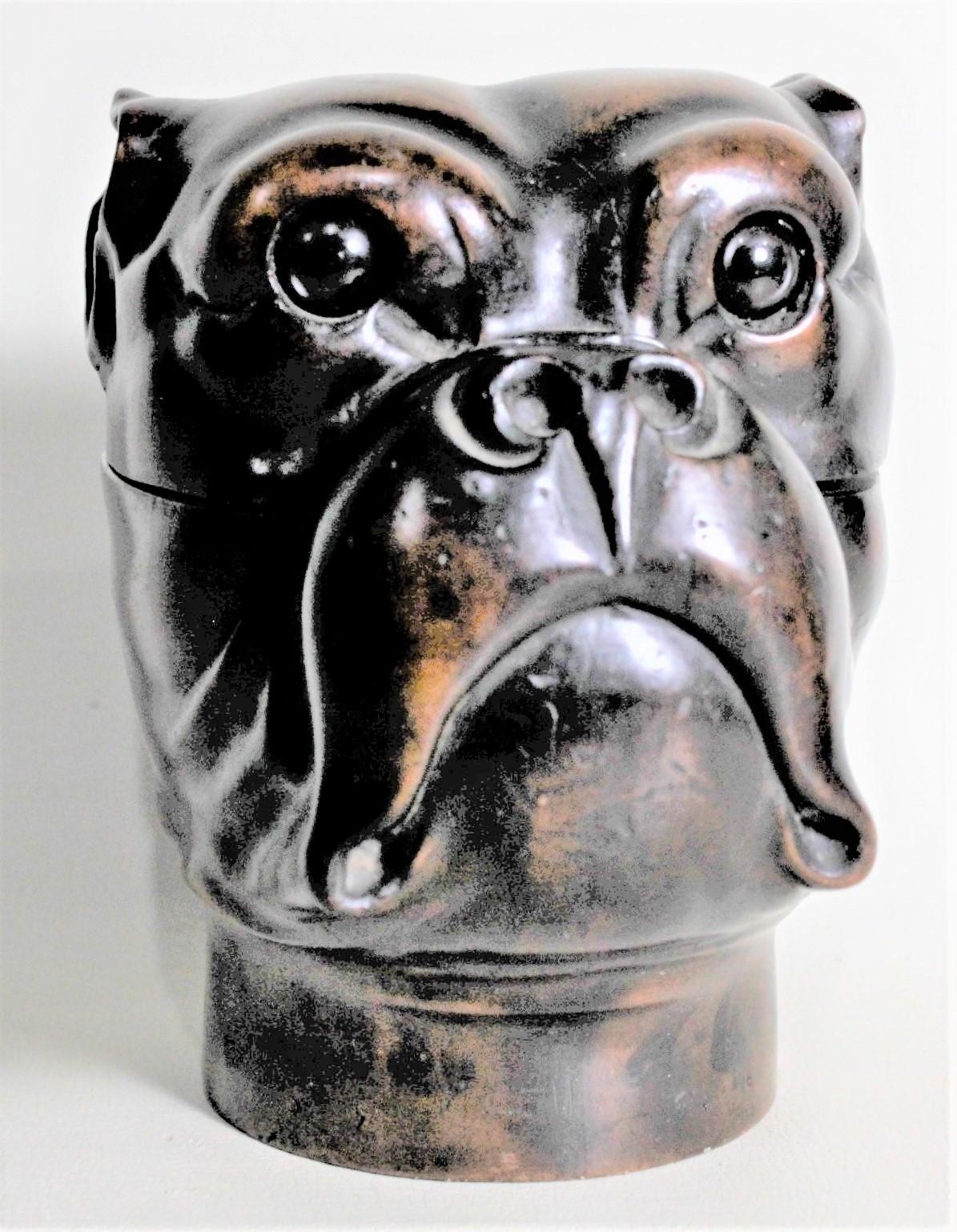 This antique hand carved dark walnut figural dog inkwell is unsigned, but presumed to have been made in Europe, likely Germany, in circa 1900 in the period Black Forest style. The hinged wooden inkwell depicts a dog's head, likely a Bulldog or