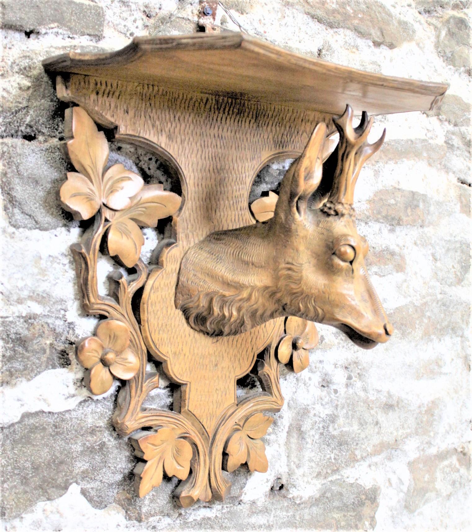 20th Century Antique Black Forest Hanging Wall Shelf with Carved Red Deer & Floral Decoration