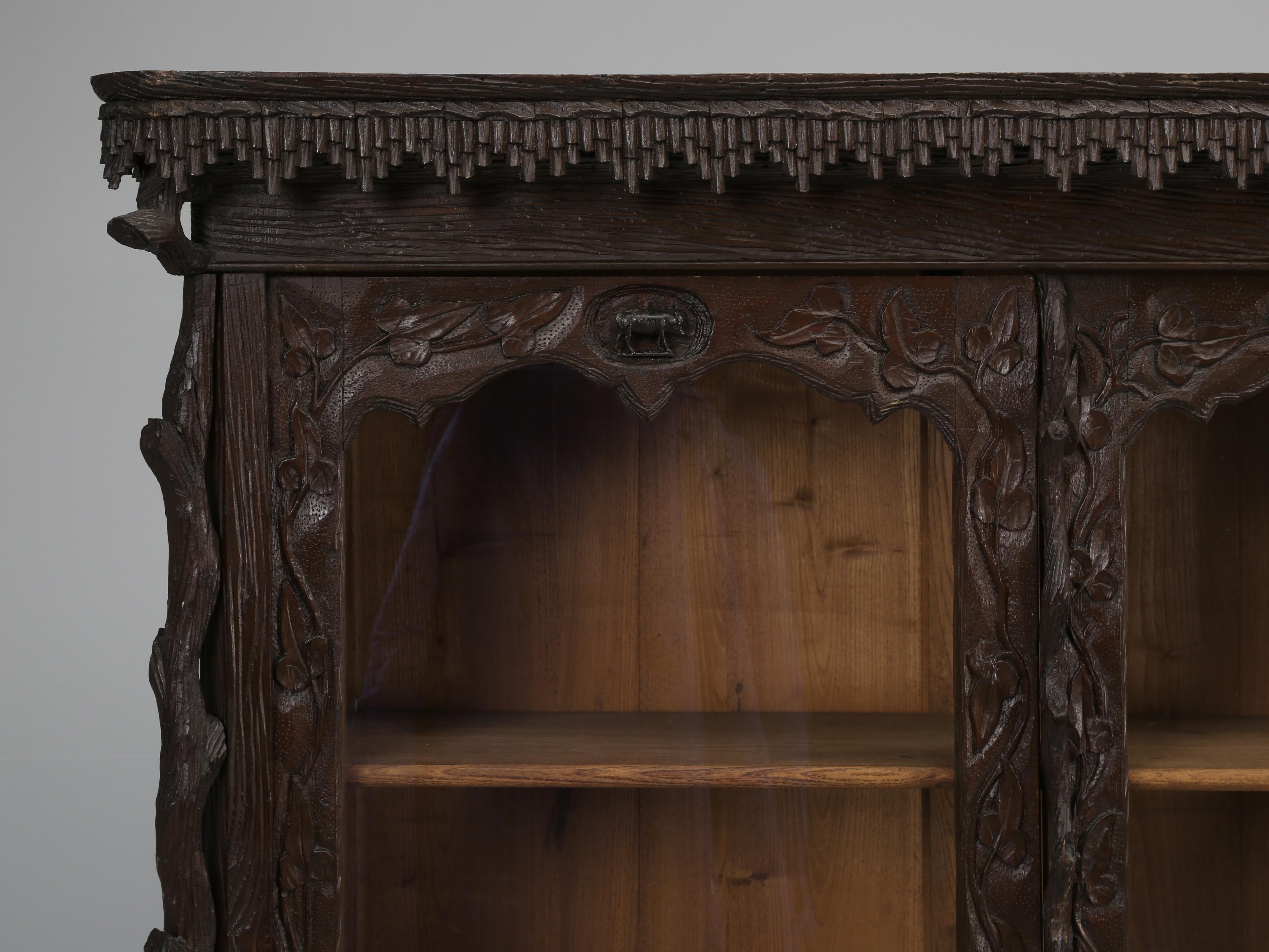Matched pair of Black Forest bookcases, that were part of a major collection of Black Forest items sold by a Chateau outside or Marseille, France. There were (42) antique Black Forest items in the chateau and we were fortunate enough to purchase the