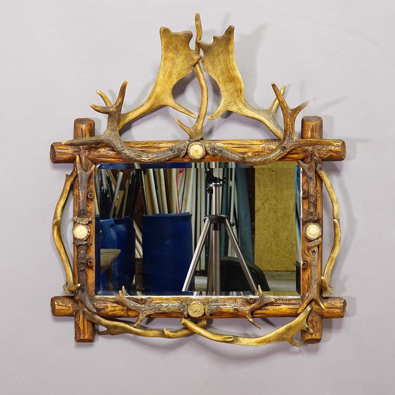 German Antique Black Forest Mirror with Rustic Antler Decorations ca. 1900