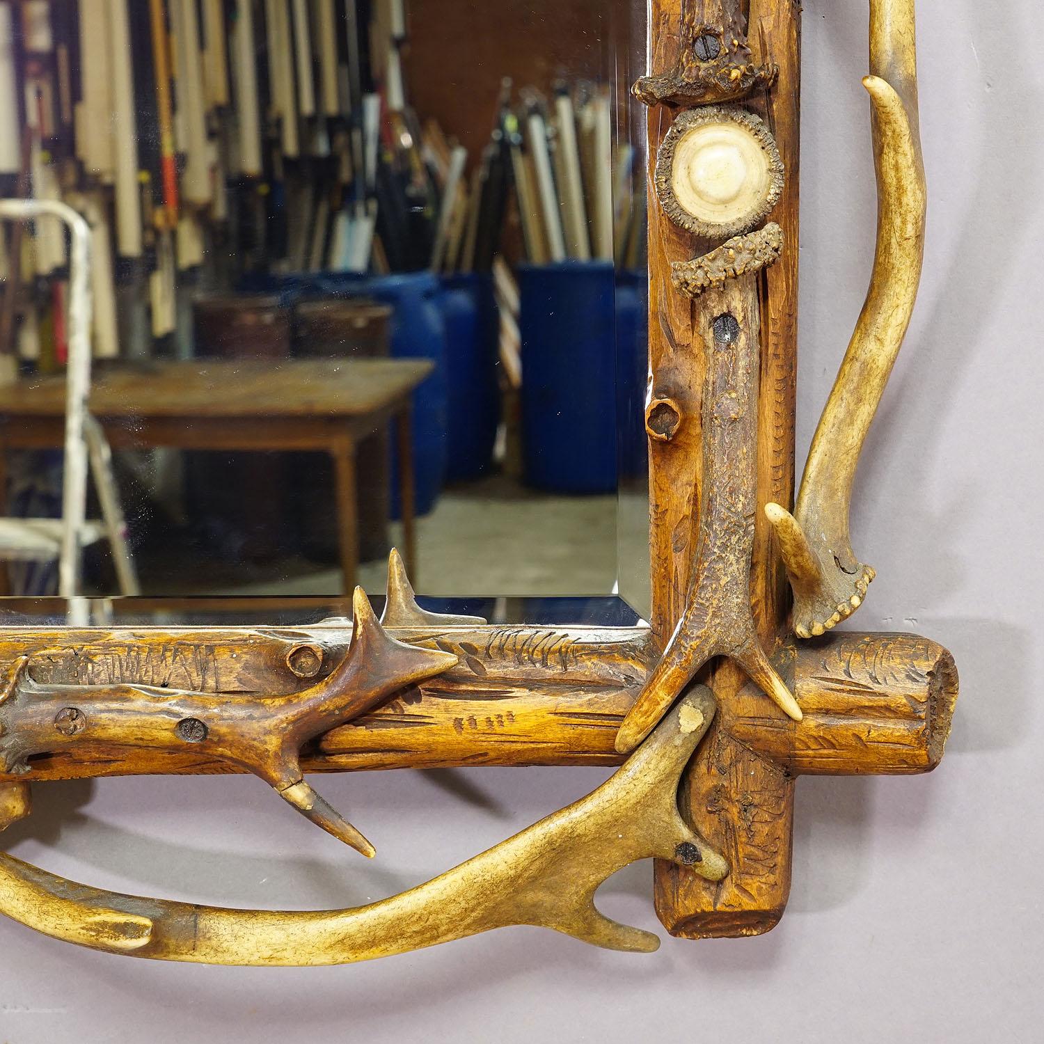 19th Century Antique Black Forest Mirror with Rustic Antler Decorations ca. 1900