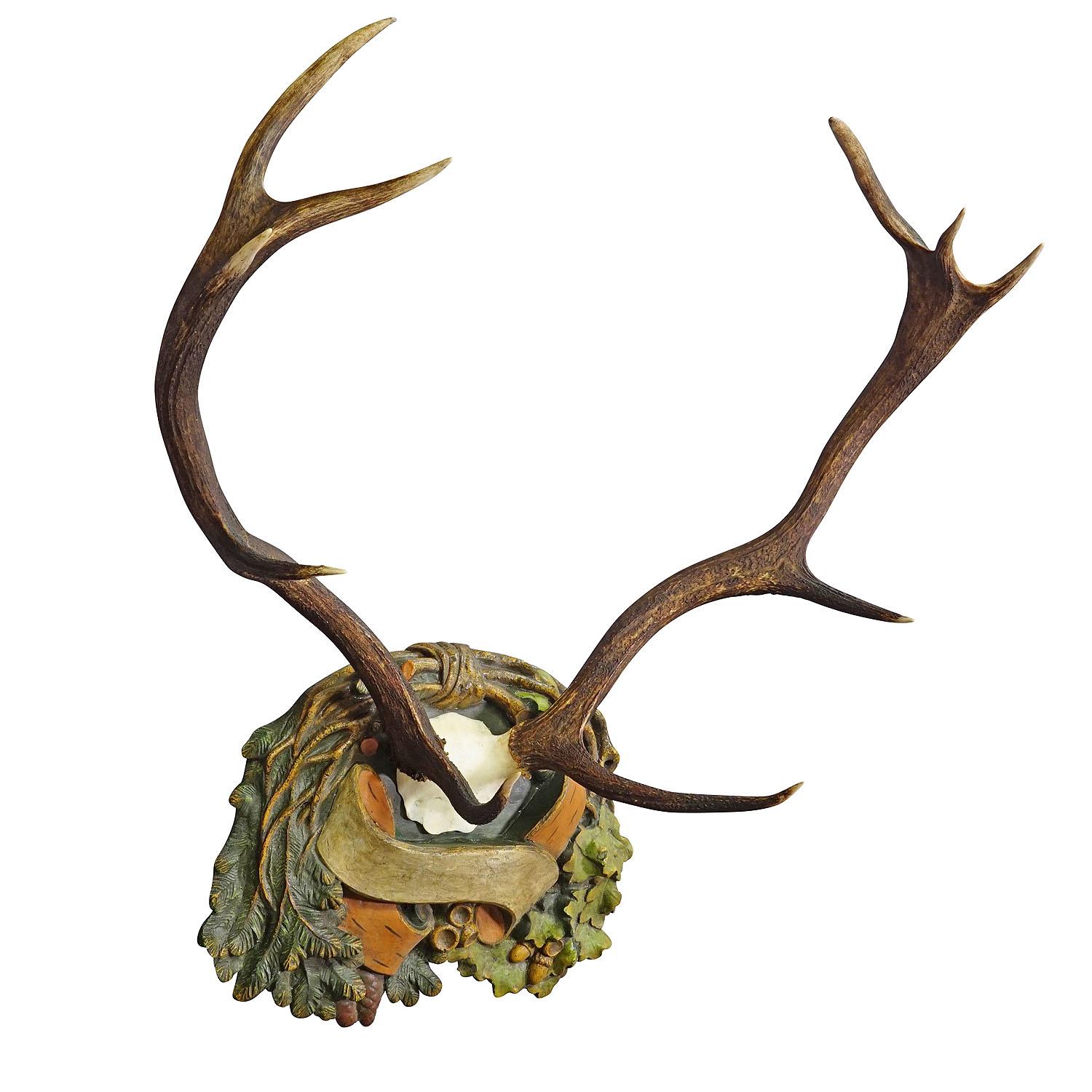 Antique Black Forest Red Deer Trophy on Reliefed Plaque - Germany ca. 1900
Item e7353
A large 10-pointer red deer trophy (Cervus elaphus) that was shot in the Black Forest around 1900. The large antlers are mounted on a wooden wall panel with relief