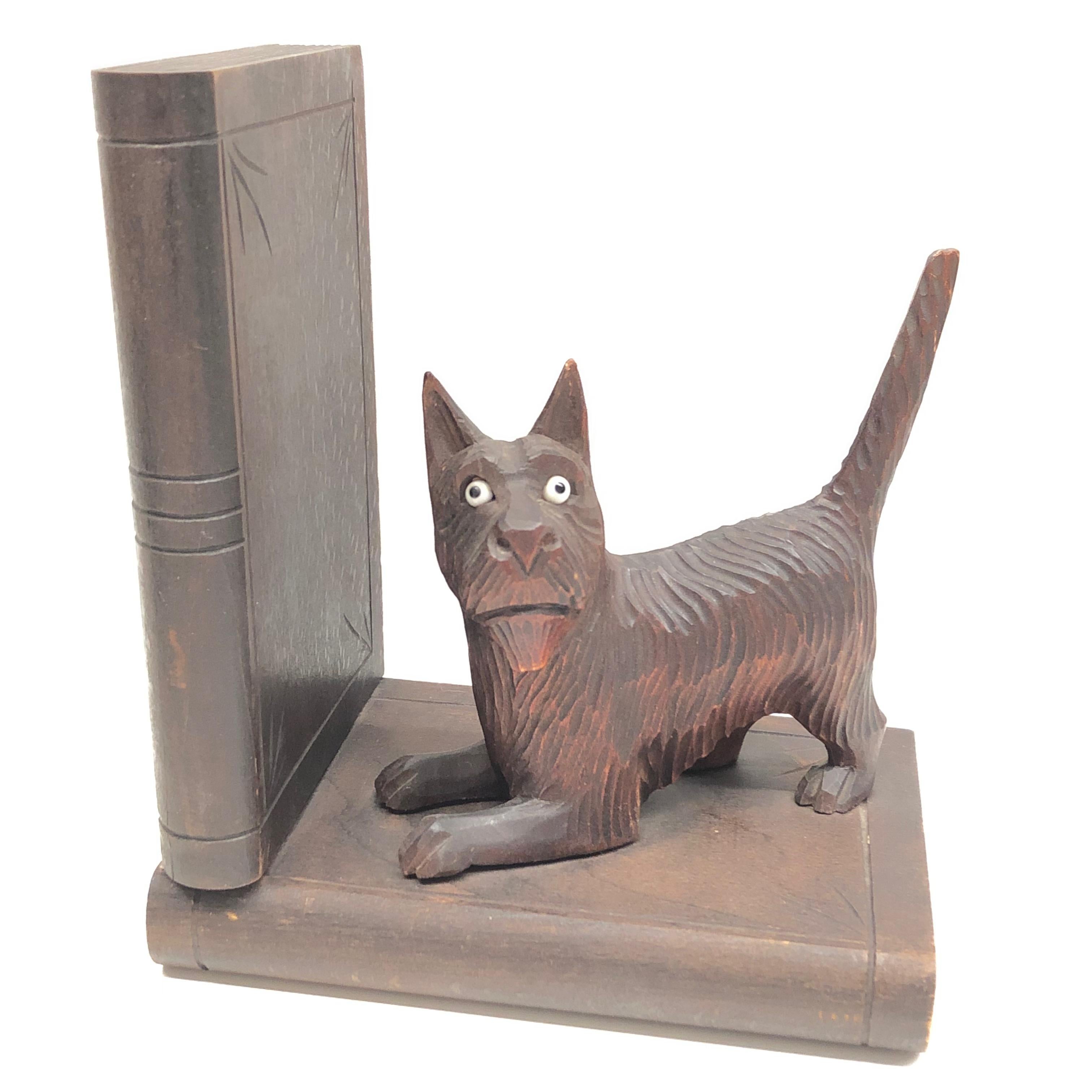 Classic early 1900s Black Forest wood carved cat and dog bookends. Nice addition to your room or just for use on your shelf. Found at an estate sale in Nuremberg, Germany. The animals are hand carved and have glass eyes.