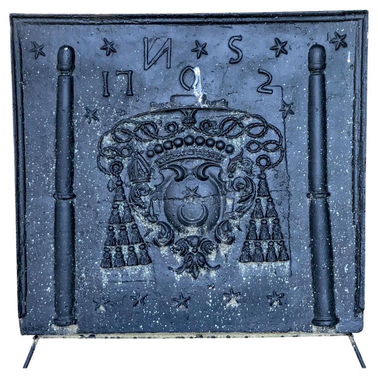 Antique Black Iron Fireback with a Tasseled Crest For Sale