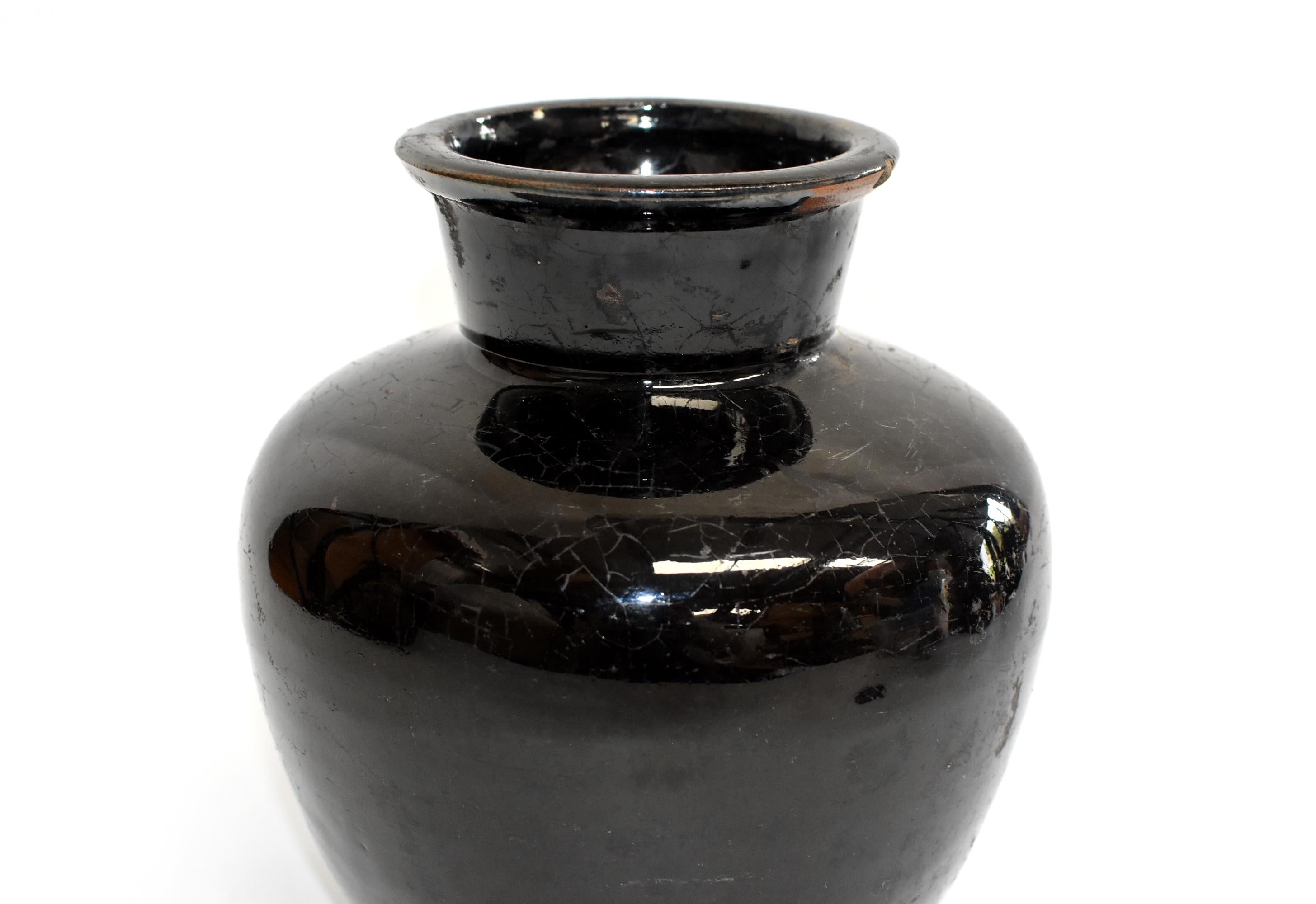 This wonderful piece is from Shan Xi province, an ancient state of China. The area is famous for producing rich, aromatic, dark vinegar. Historically these jars were used to store the prized liquids. Now, their rustic, artistic appeal with the