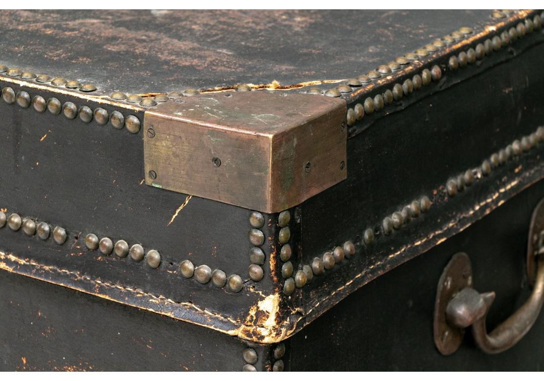 Antique Black Leather Campaign Trunk as Cocktail Table 1