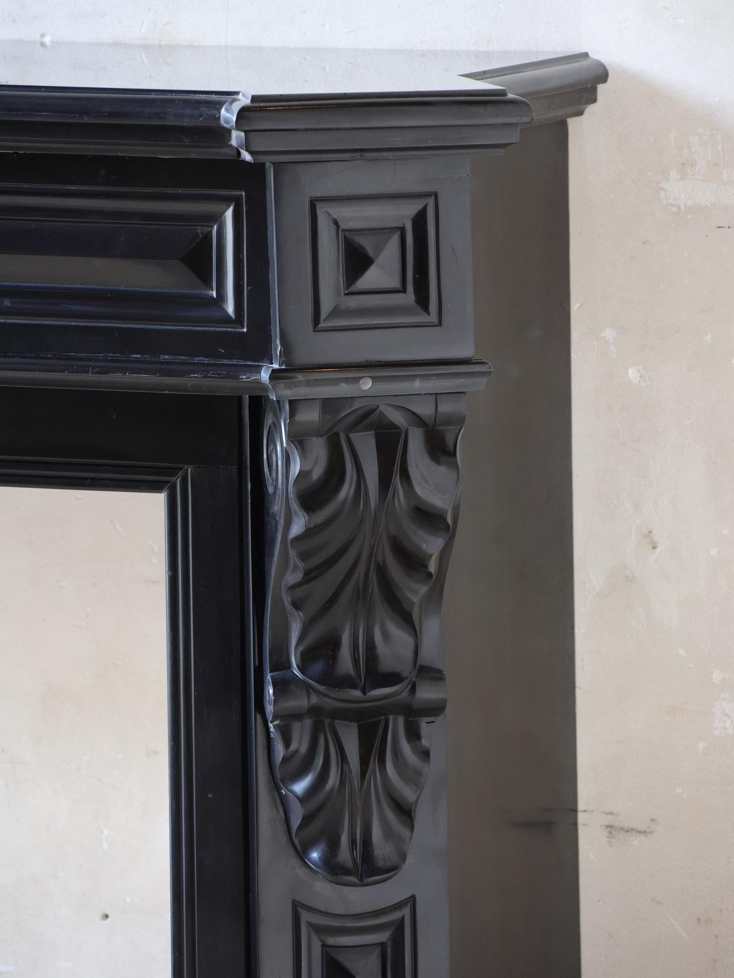 19th Century Antique black marble Modillion mantelpiece For Sale
