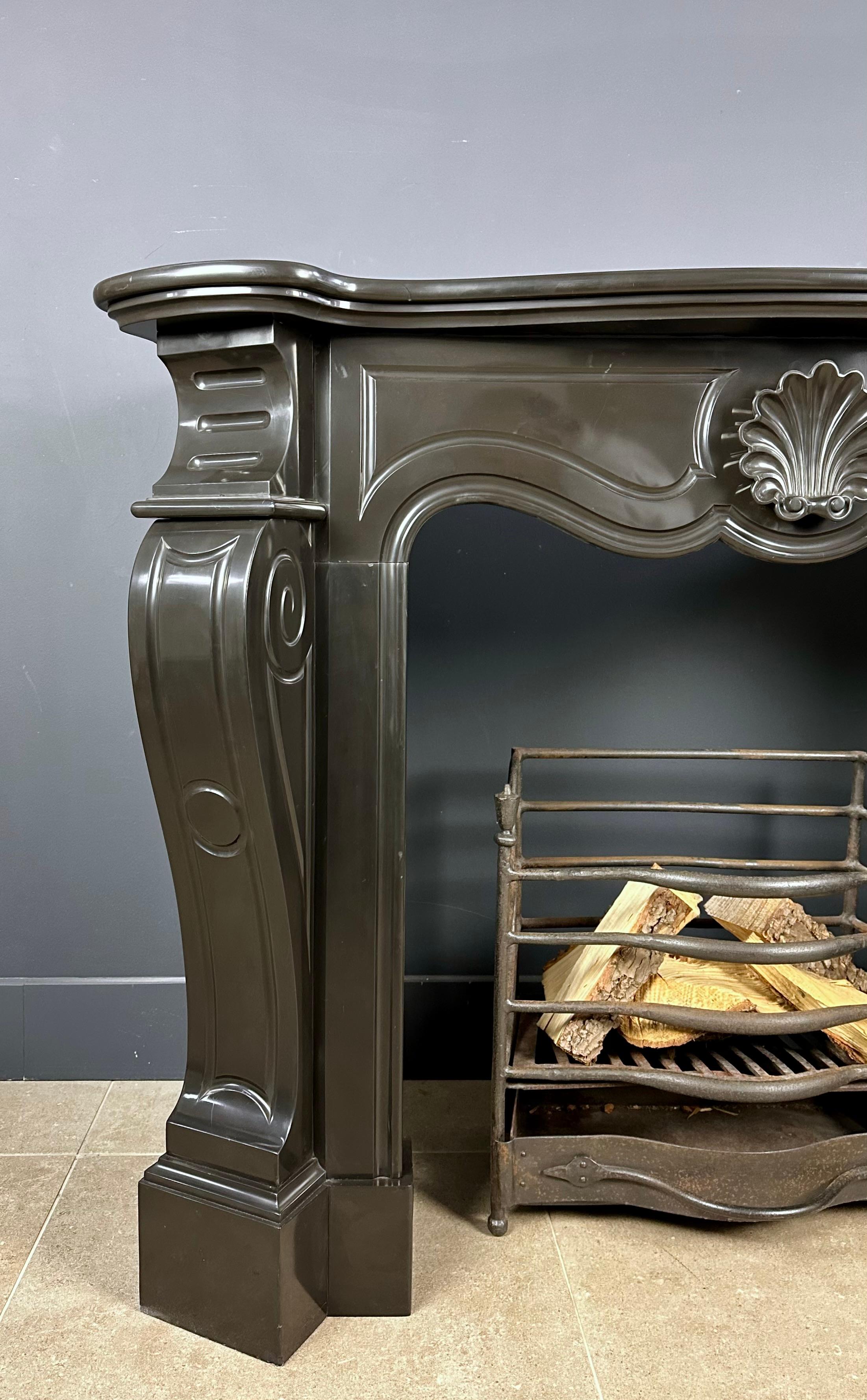Enrich your living space with the timeless allure of our Black Antique Circular Fireplace. Restored and repolished with extreme care, this fireplace exudes an unmistakable sense of history and elegance.

This beautiful mantel is perfect for creating