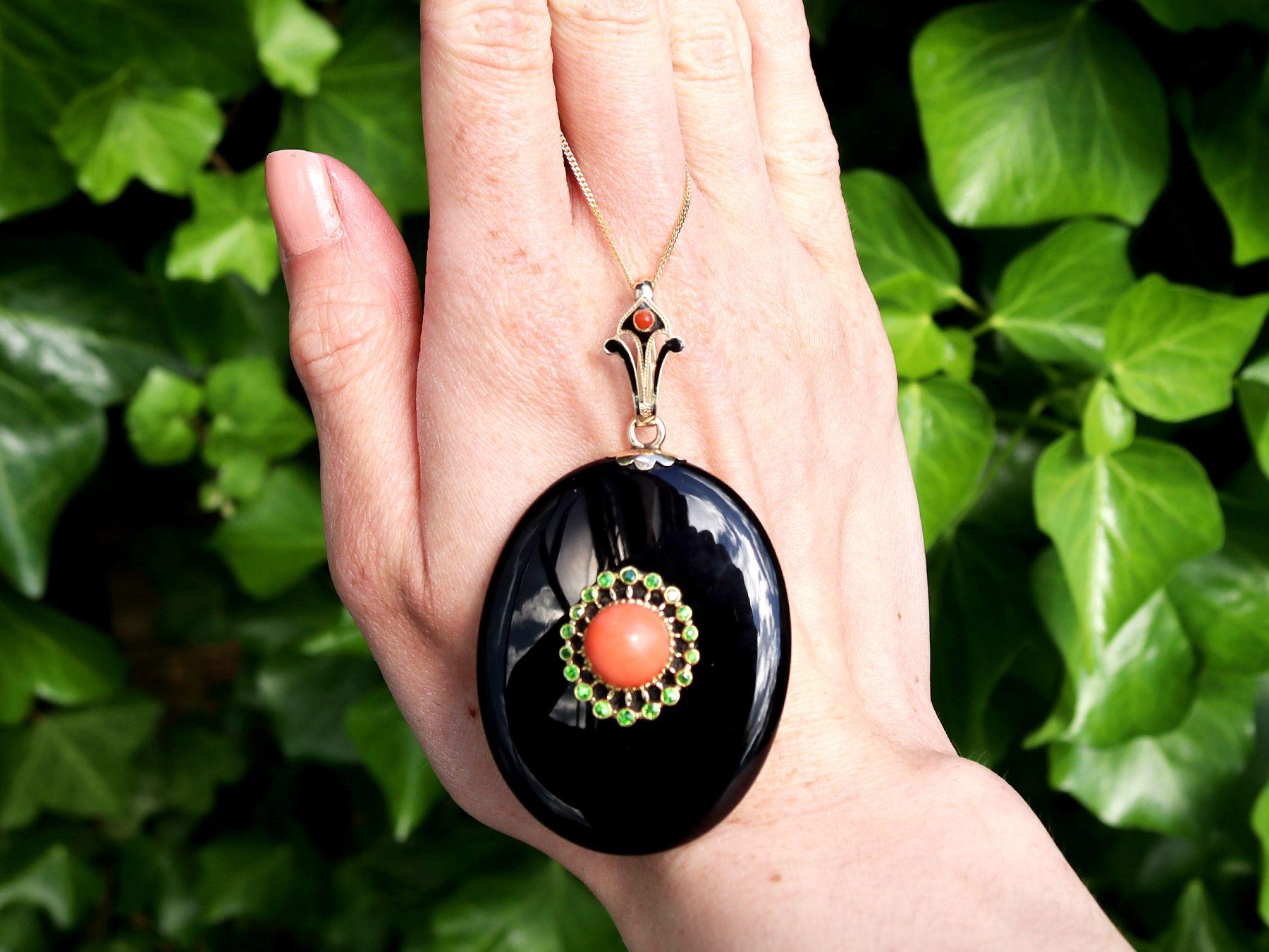 A stunning, fine and impressive antique black onyx, 3.50 carat coral and 0.36 carat demantoid garnet, 12ct karat yellow gold pendant; part of our diverse Victorian gemstone jewellery and estate jewelry collections.

This stunning, fine and
