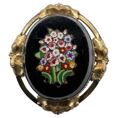 Antique black onyx brooch with micromosaic flower, 1900s