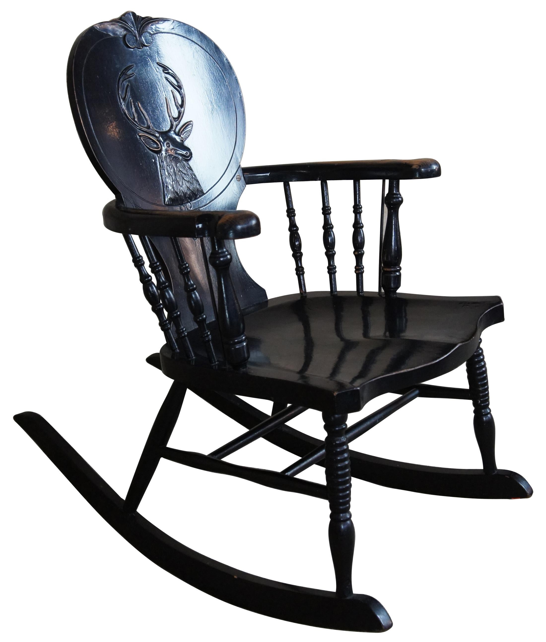 Antique oak stag back rocking chair. Features a ten point buck in the style of black forest.
 