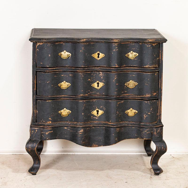 black chest of drawers and nightstand
